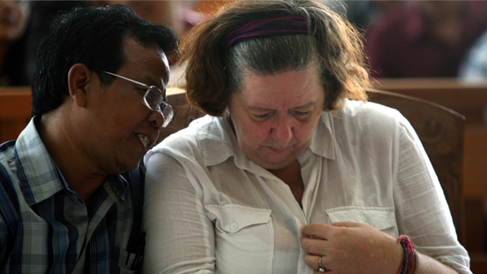 Jan. 22, 2013: Lindsay June Sandiford of Britain, right, listens to her interpreter during her sentencing at a courthouse, in Denpasar, Bali island, Indonesia.