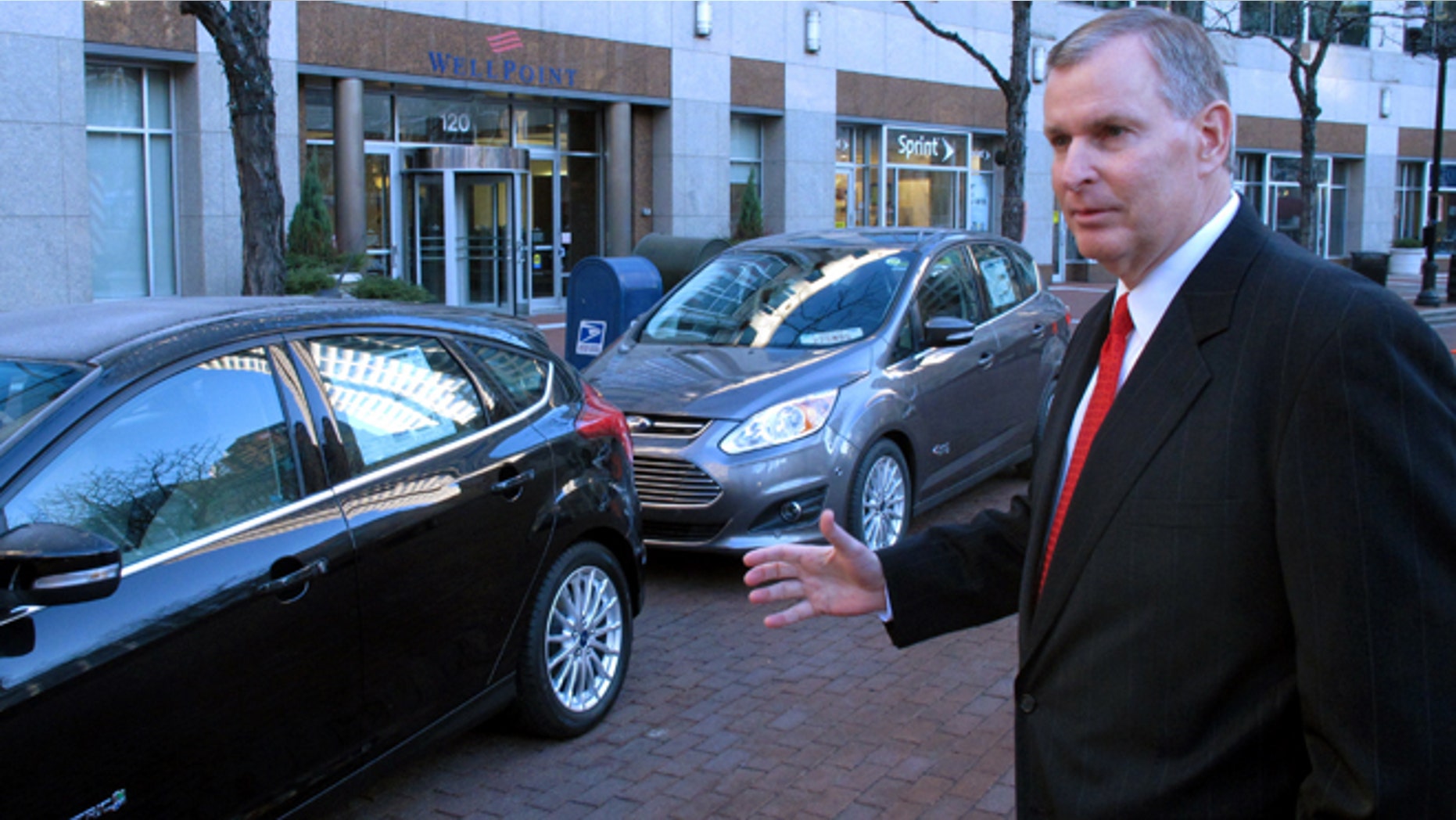Indianapolis Mayor Greg Ballard talks about replacing it's fleet of cars with electric and plug-in hybrids like these shown following an announcement in Indianapolis, Wednesday, Dec. 12, 2012. Indianapolis plans to replace its entire fleet with electric and plug-in hybrid vehicles by 2025. (AP Photo/Rick Callahan)