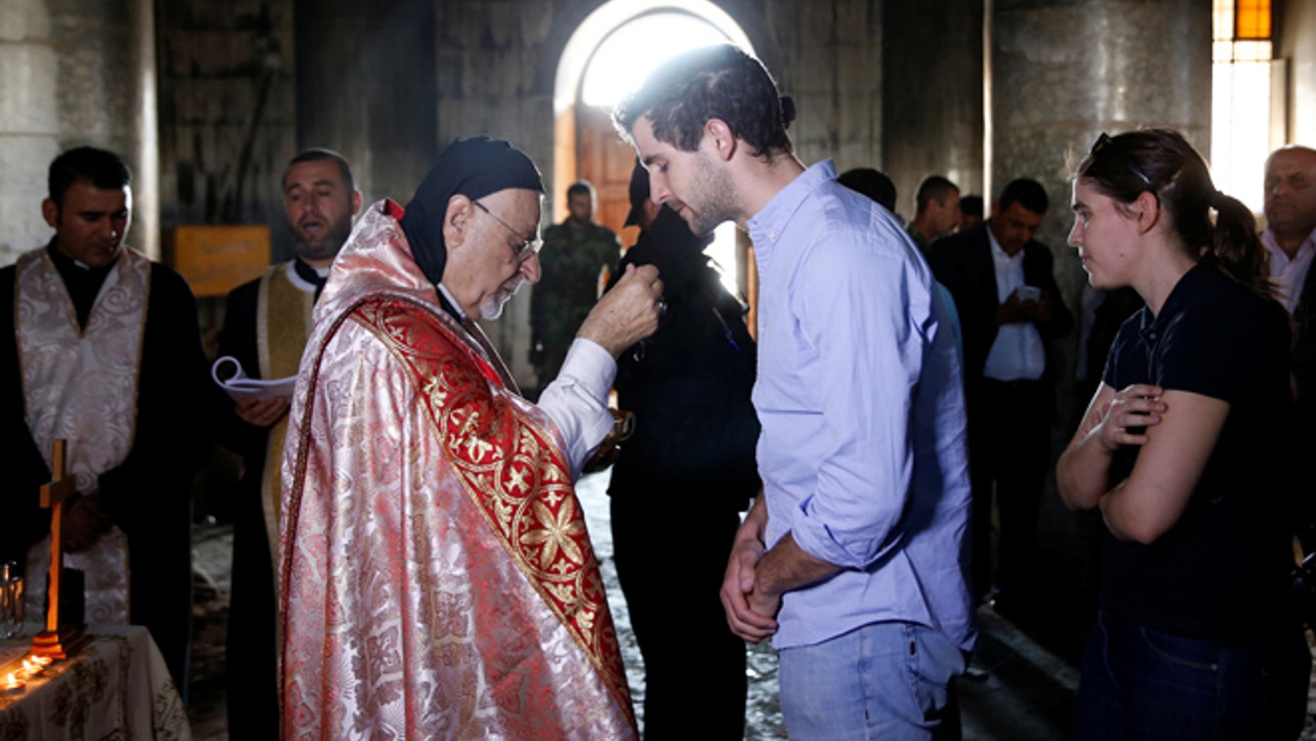 OCT 30: Iraqi priests hold the first Sunday mass at the Grand Immaculate Church since it was recaptured from Islamic State in Qaraqosh.