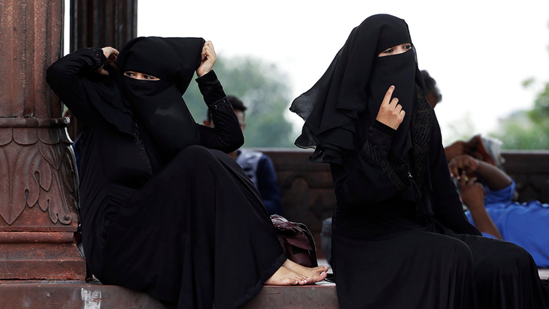 Indian Muslim women rest inside Jama Masjid mosque in New Delhi, India. India's government has approved an ordinance to implement a top court ruling striking down the Muslim practice that allows men to instantly divorce.