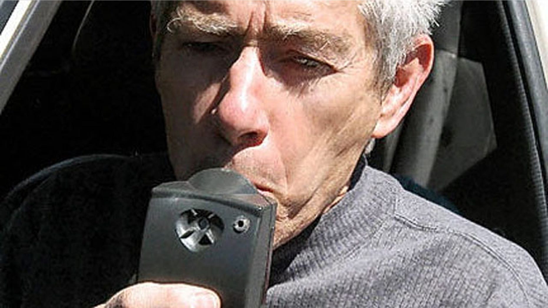 Richard Roth, a lobbyist for the ignition interlock device for drunk drivers, demonstrates the device in Santa Fe, N.M., in 2005. New Mexico saw a significant drop in repeat DWI offfenders after introducing the device.
