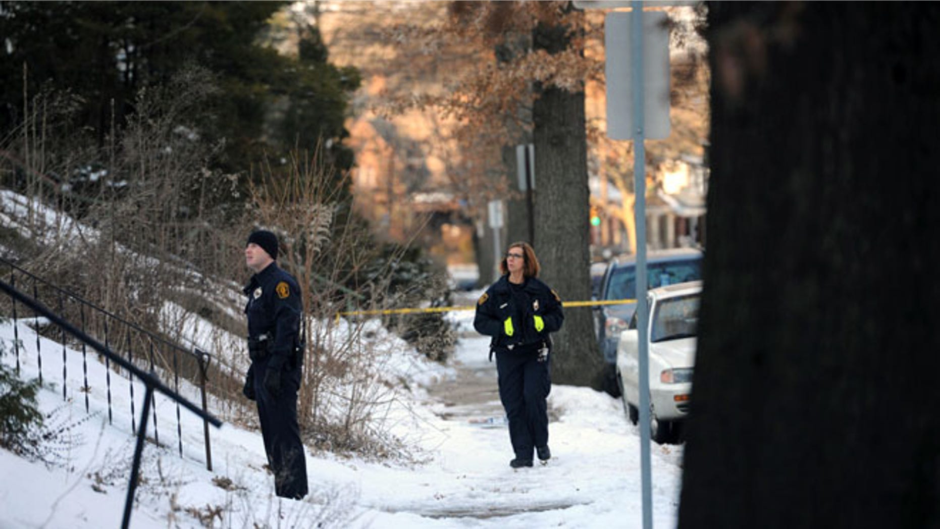 Feb. 7, 2014: Police investigate the scene were the bodies of sisters Susan Wolfe and Sarah Wolfe were found in the basement of their home in Pittsburgh. The two were sisters of an Iowa state representative, Mary Wolfe. Police said that they are investigating the case as a double homicide.