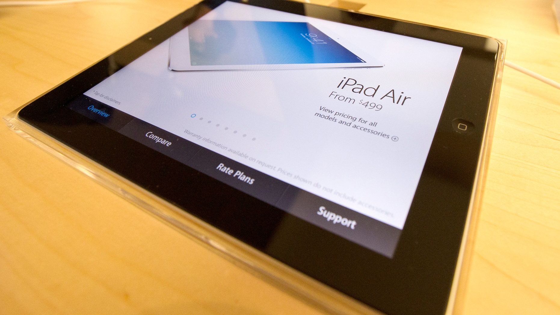 File photo - A display shows a new Apple iPad Air tablet inside the Apple Store on New York's fifth avenue, Nov. 1, 2013. (REUTERS/Mike Segar)