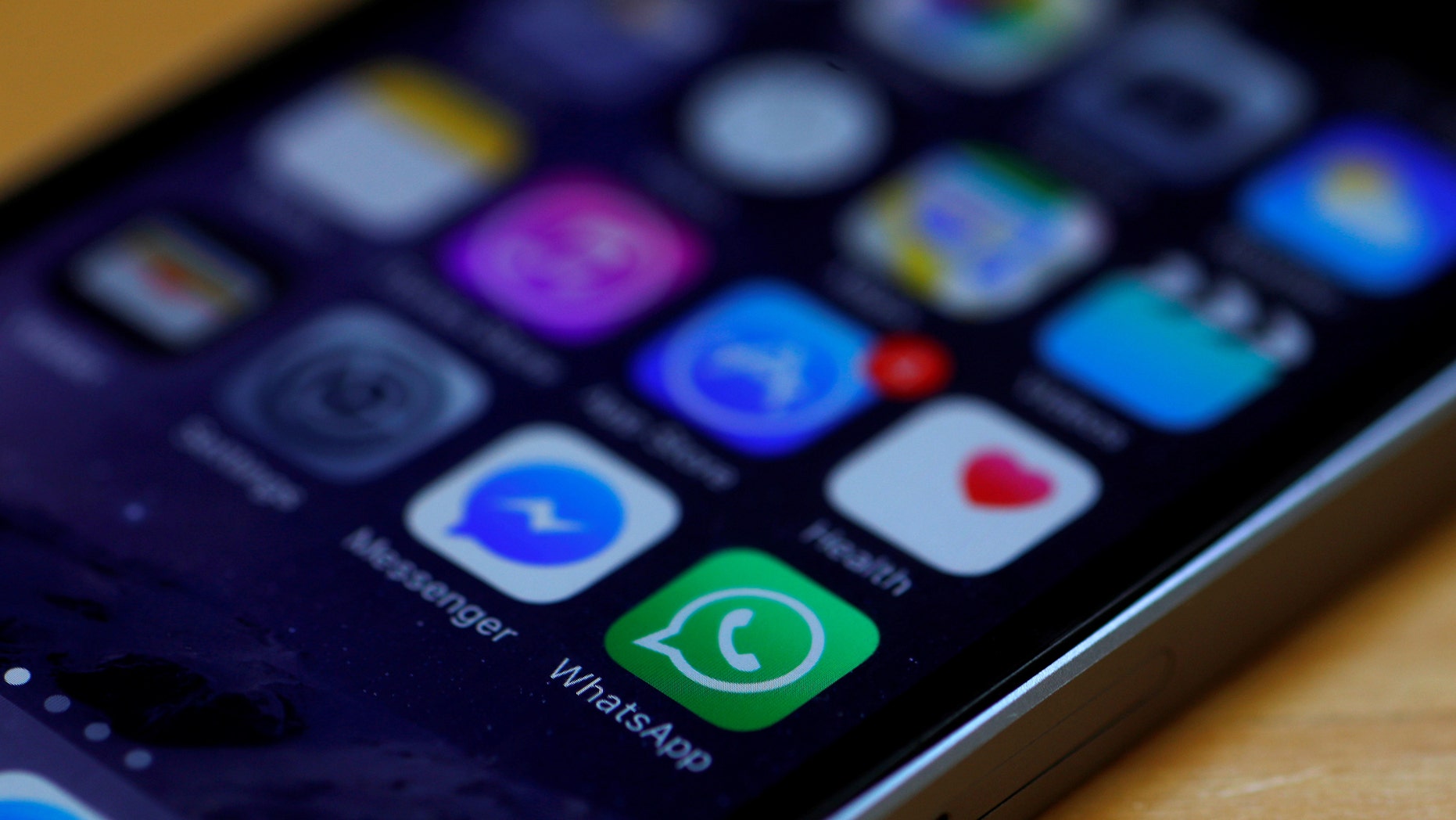 File photo: WhatsApp and Facebook messenger icons are seen on an iPhone in Manchester, Britain March 27, 2017. (REUTERS/Phil Noble )