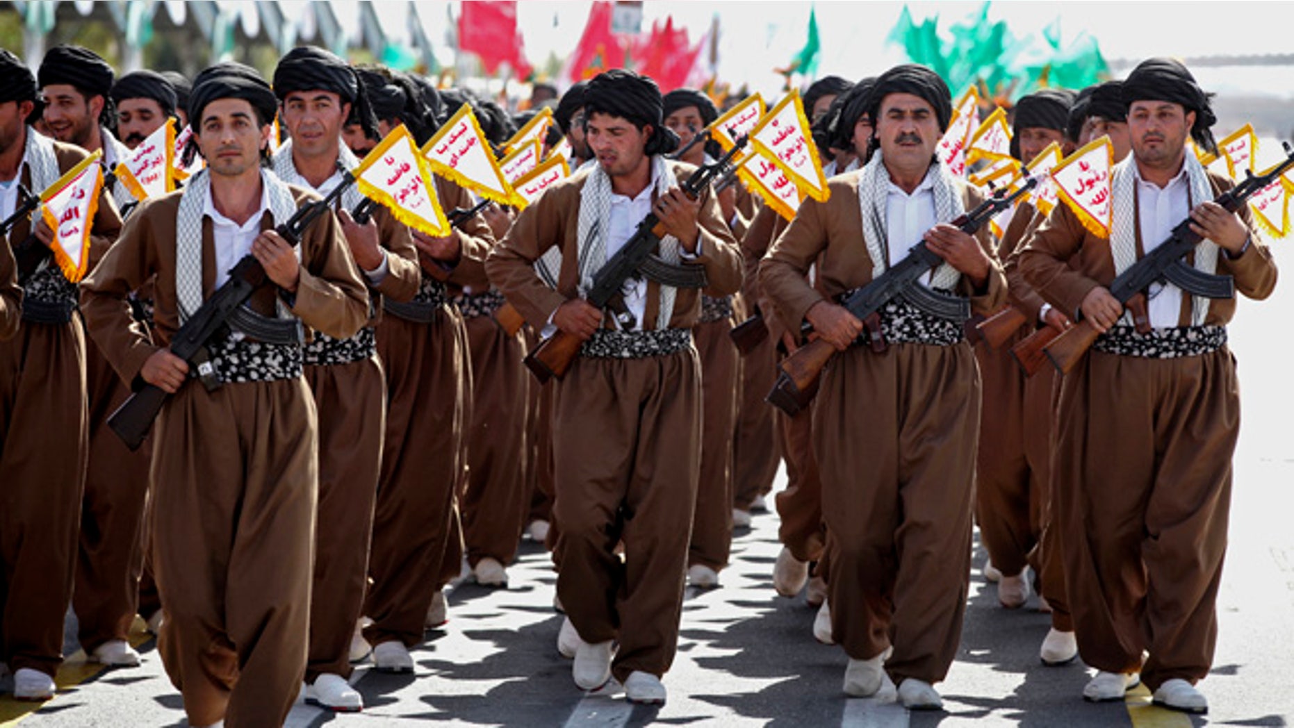 Sept, 22, 2013: Kurd volunteer members of Basij, the Revolutionary Guards paramilitary branch, march during an annual military parade in Tehran, Iran.