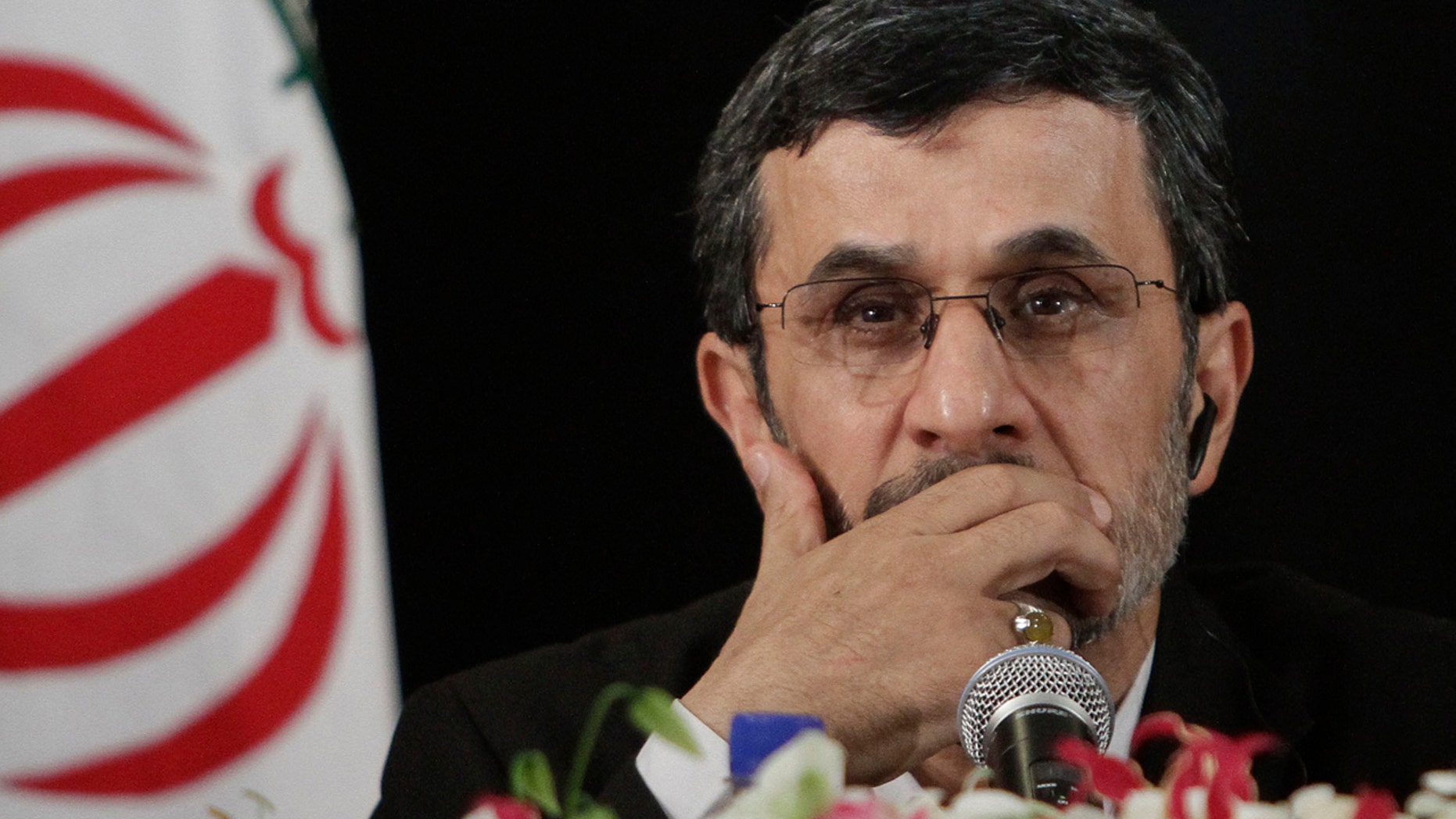 FILE- In this Wednesday, Sept. 26, 2012 file photo, President of Iran, Mahmoud Ahmadinejad listens during a news conference after addressing the 67th session of the United Nations General Assembly on Wednesday, Sept. 26, 2012 in New York.