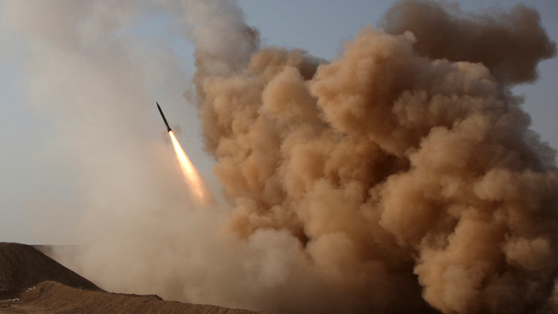 In this photo released by the semi-official Iranian Fars News Agency, and taken on Tuesday, June 28, 2011, a Zelzal missile is launched by the Iranian revolutionary Guards during their maneuvers outside the city of Qom, Iran.