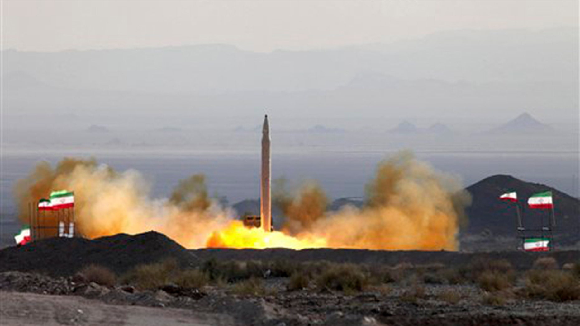 This Aug. 20 photo, by the Iranian Defense Ministry, claims to show the launch of the Qiam-1 liquid-fueled missile by Iranian armed forces, at an undisclosed location. It is an example of Iran's potential retaliatory power. (AP Photo)