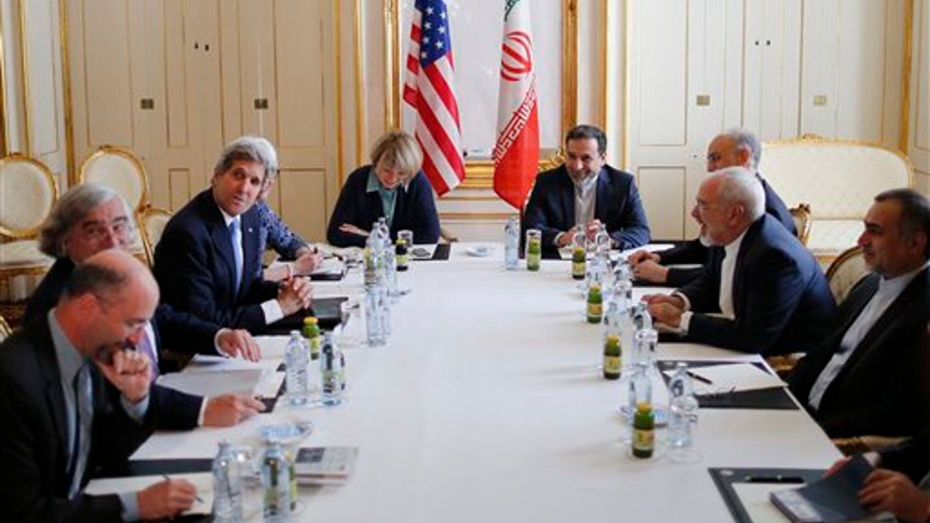 U.S. Secretary of State John Kerry, 3rd left, meets with Iranian Foreign Minister Javad Zarif, 2nd right, at an hotel in Vienna, Wednesday July 1, 2015. The head of the U.N. agency tasked to monitor a nuclear deal is traveling to Tehran to meet with Iranian President Hassan Rouhani, the agency said Wednesday. (Carlos Barria/Pool Photo via AP)