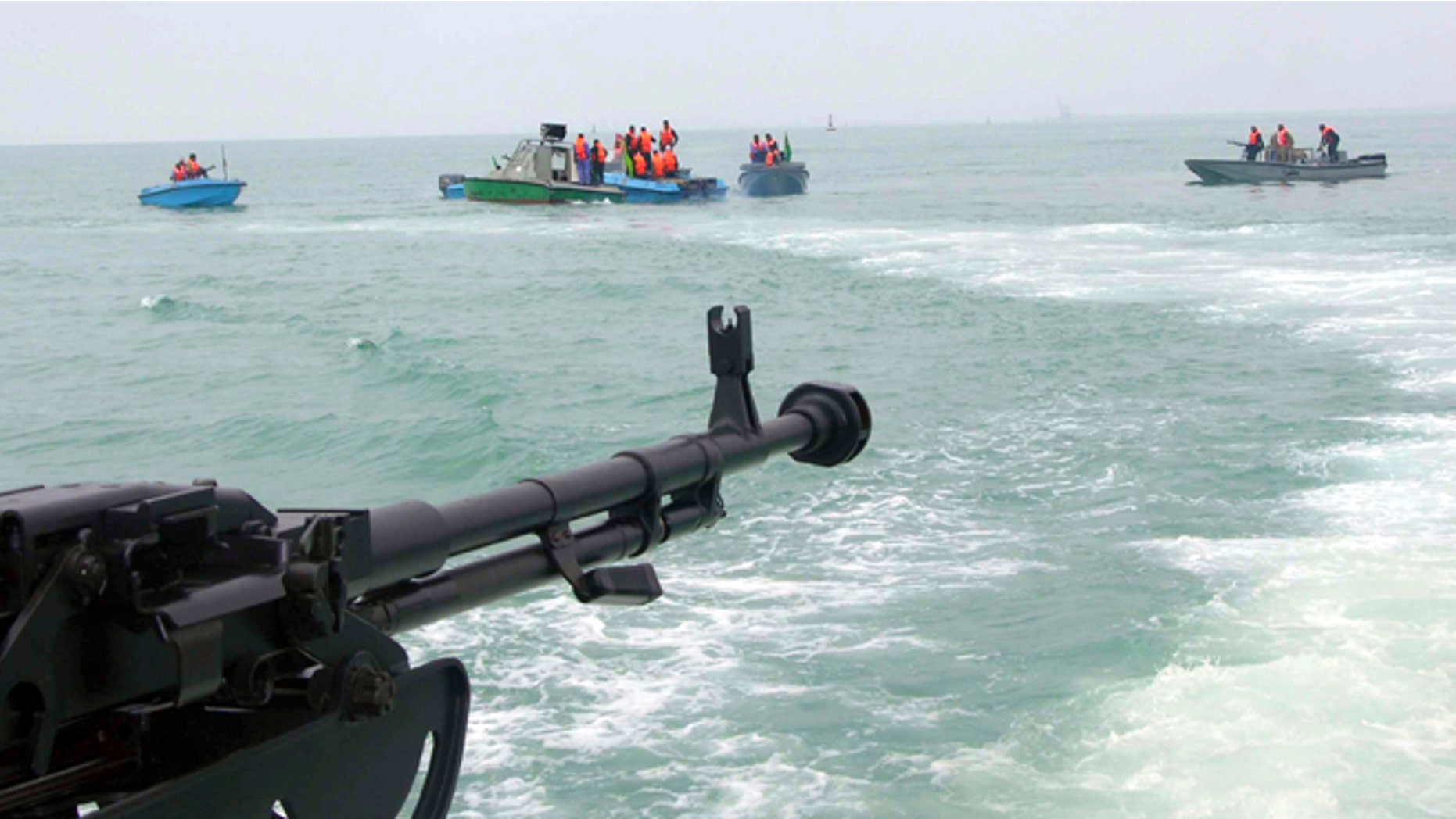 In this file photo taken on April 3, 2006, members of Iran's elite Revolutionary Guard attend maneuvers in the Persian Gulf.
