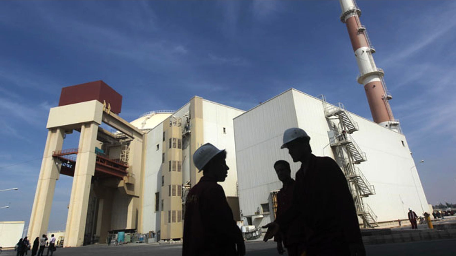 Oct. 26, 2010: Iranian workers stand in front of the Bushehr nuclear power plant, about 1,200 km south of Tehran. (Reuters)