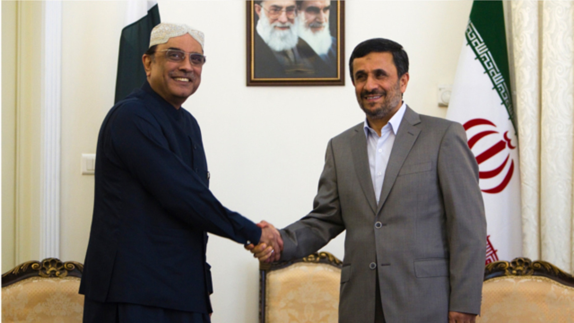 July 16, 2011: Iran's President Mahmoud Ahmadinejad (R) shakes hands with his Pakistani counterpart Asif Ali Zardari during a meeting in Tehran