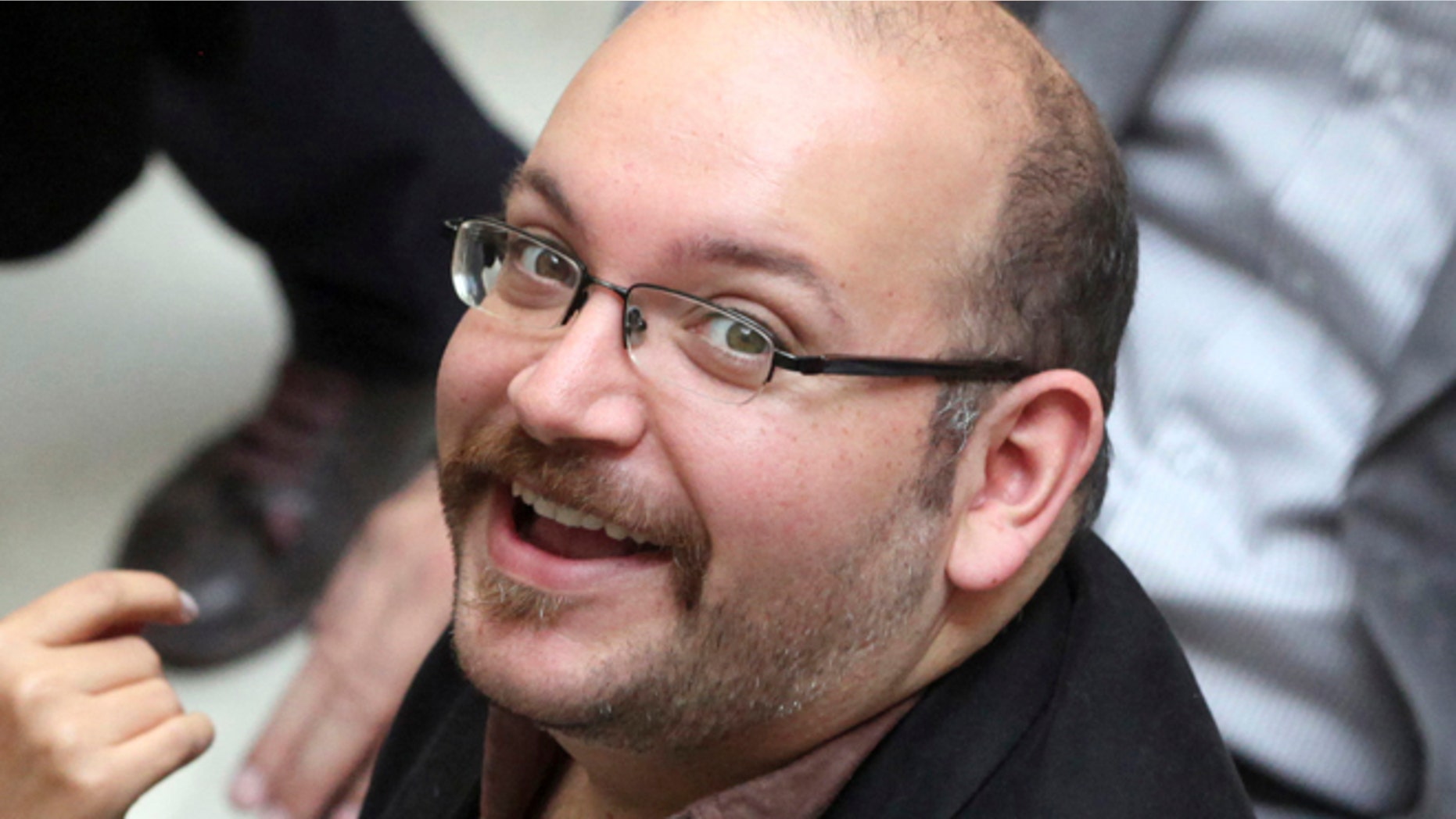 April 11, 2013: Jason Rezaian, an Iranian-American correspondent for the Washington Post smiles as he attends a presidential campaign of President Hassan Rouhani in Tehran, Iran.(AP)