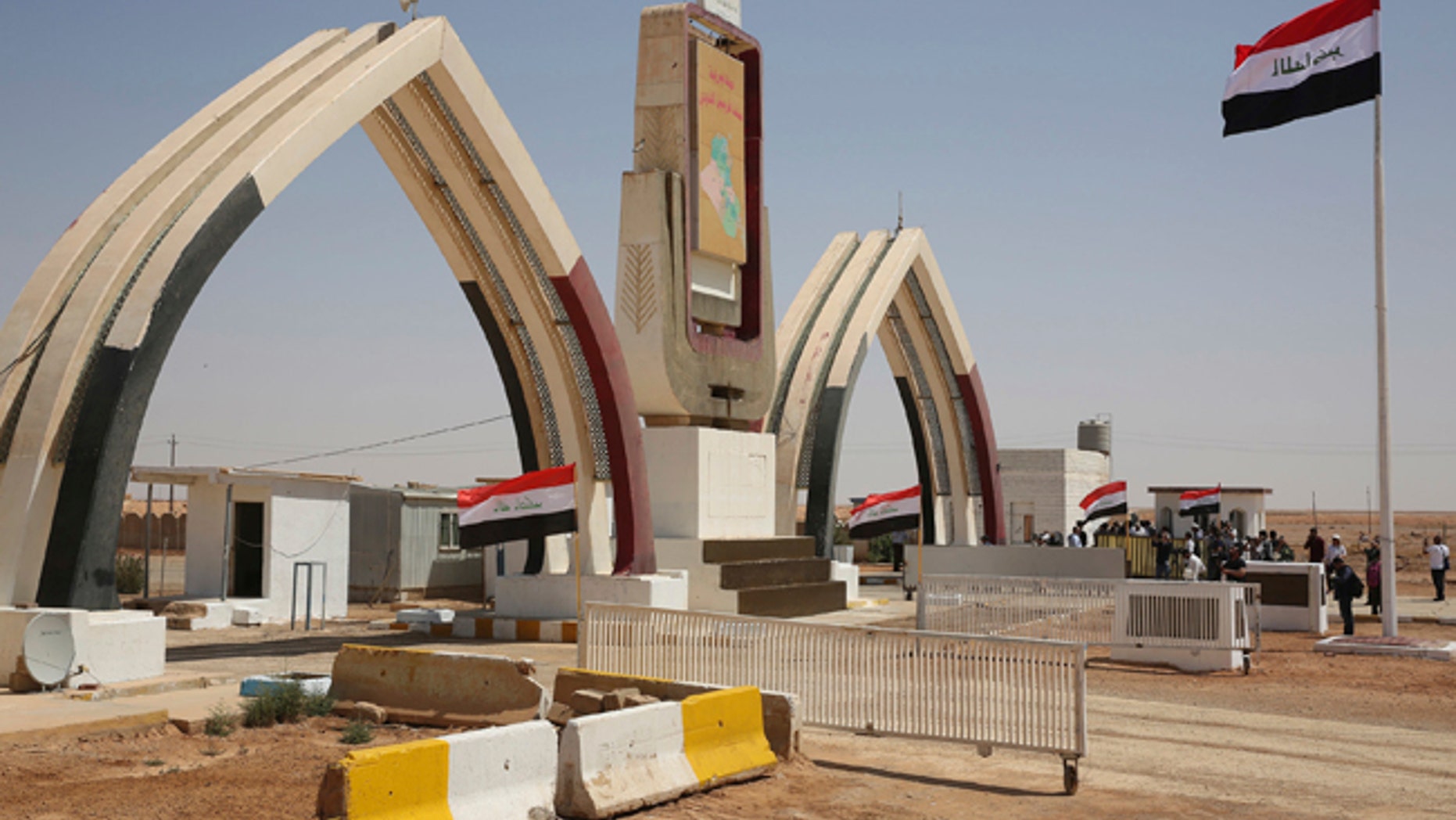Iraqi flags fly at the recently opened Iraqi Trebil border crossing on the Iraq-Jordan border on Aug. 30, 2017.