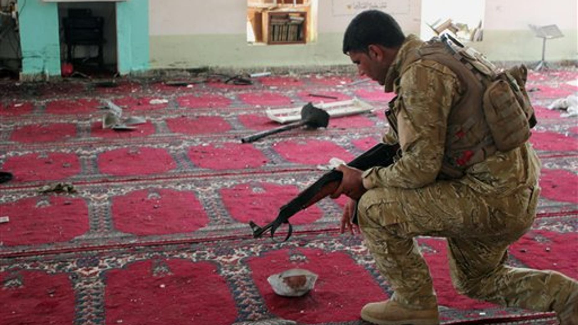 July 19, 2013 - An Iraqi army soldier inspects the damage inside the Abu Bakr Mosque in Baqouba, northeast of Baghdad, Iraq. A bomb hidden in an air conditioner that ripped through a Sunni mosque during midday prayers and other attacks killed dozens in Iraq on Friday, extending a wave of violence targeting worshippers during the holy month of Ramadan.