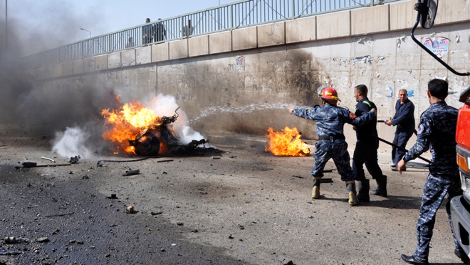 June 16, 2013: Firemen try to put out a burning vehicle after a car bomb attack, where police reported two dead and 19 injured, in Nasiriyah city, 233 miles south of Baghdad. At least 20 people were killed in car bombings and shootings across Iraq on Sunday, police and medics said. The car bombs were mainly in provinces with a high concentration of Shiite Muslims and one shooting took place in the northern city of Mosul.