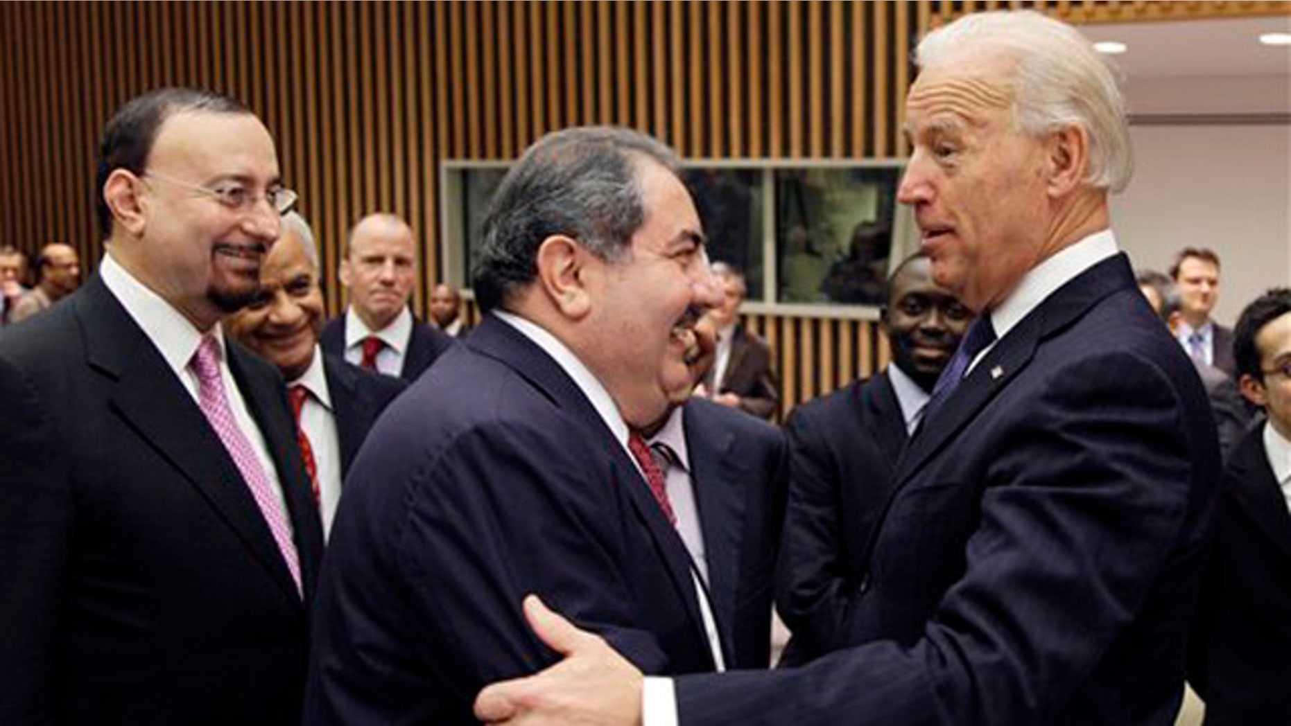 Dec. 15, 2010: U.S. Vice President Joe Biden, right, greets Iraqi Foreign Minister Hoshyar Zebari, center, before a meeting of the United Nations Security Council. At left is Hamid al-Bayati, Iraq's U.N. ambassador.
