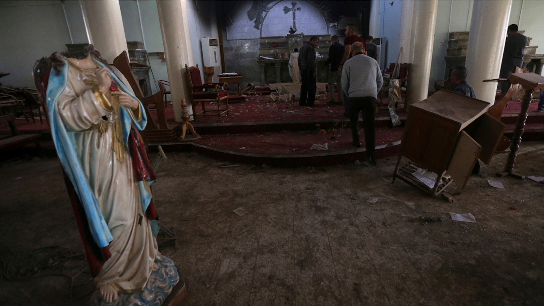 Nov. 13, 2016: Iraqi Christian citizens check the St. Addai church which was damaged by Islamic State fighters during their occupation of Keramlis village, less than 18 miles southeast of Mosul.