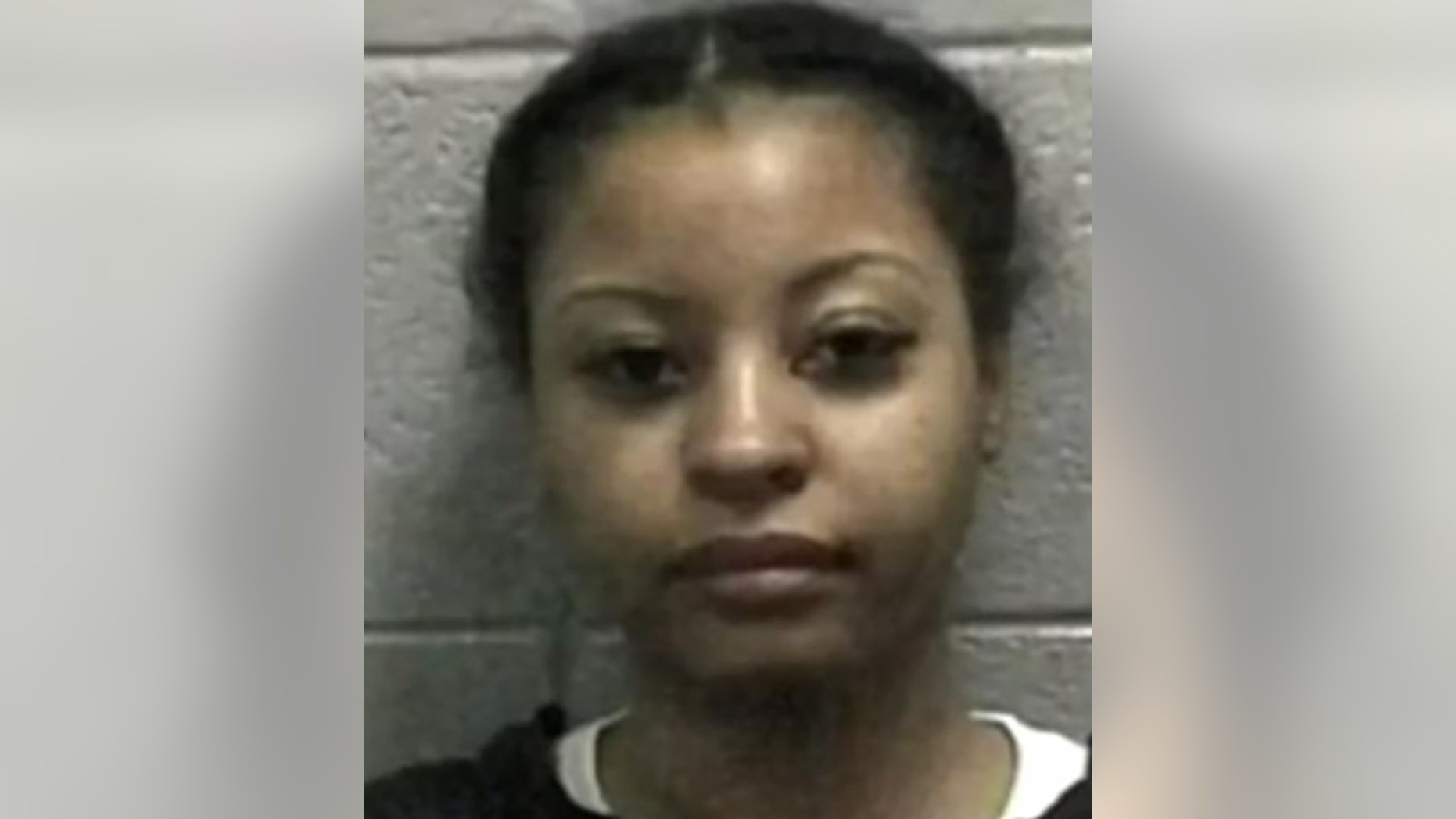 Officer Iris Rowe resigned Wednesday after her arrest during a drug raid in College Park, Ga., on Monday, police said.