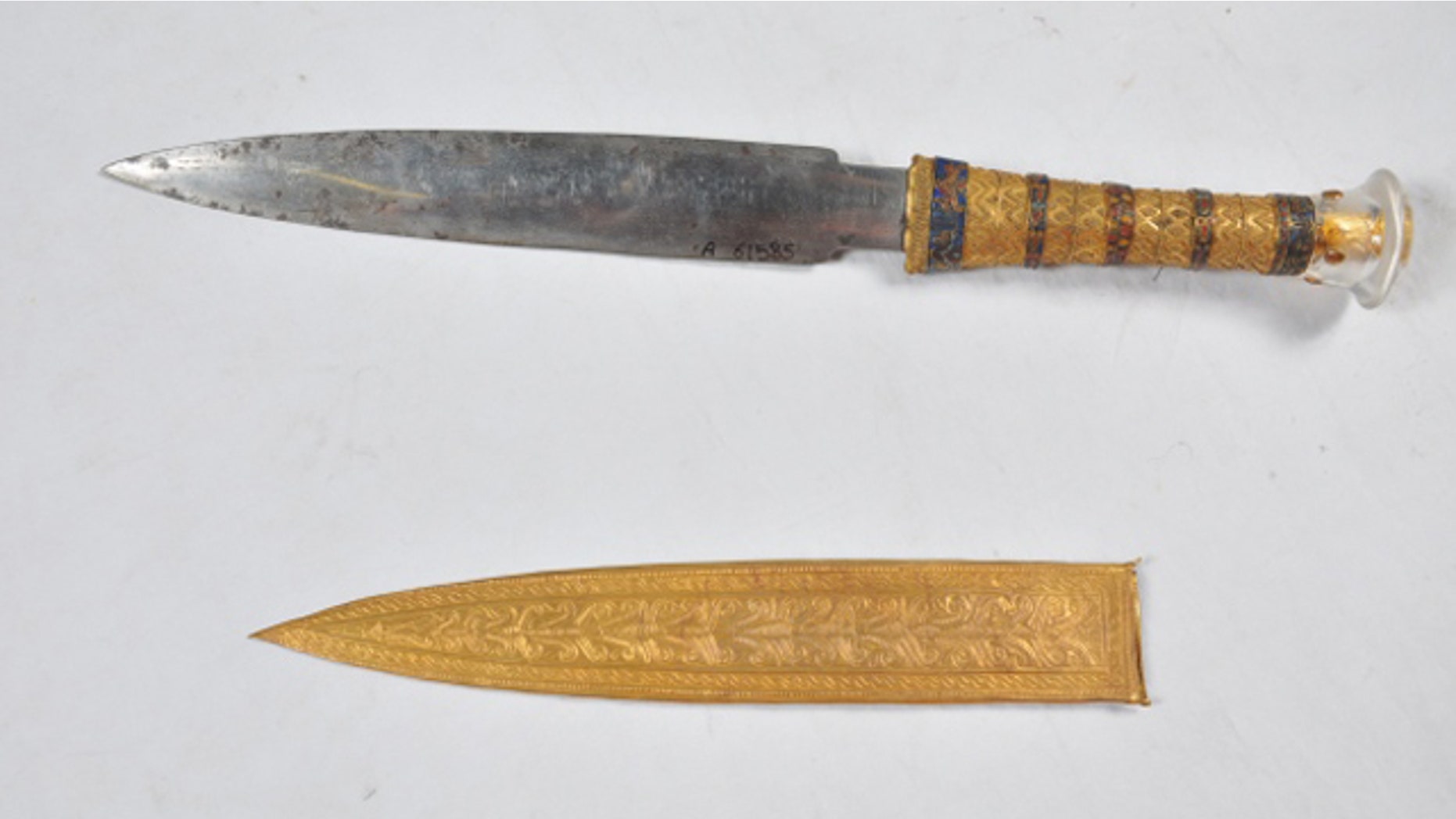 This undated image shows a dagger and sheath found in the tomb of the Egyptian pharaoh Tutankhamun