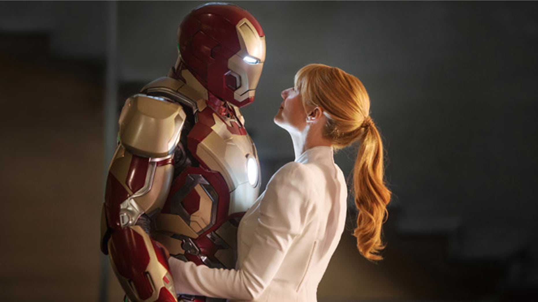 This film publicity image released by Disney-Marvel Studios shows Robert Downey Jr., left, as Tony Stark/Iron Man and Gwyneth Paltrow as Pepper Potts in a scene from "Iron Man 3."