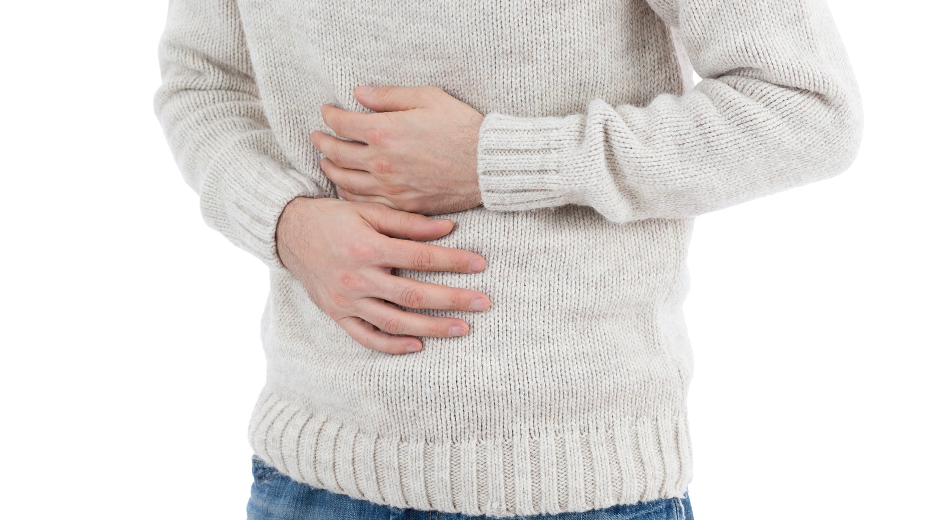 Man holding his aching stomach. Isolated on white background.