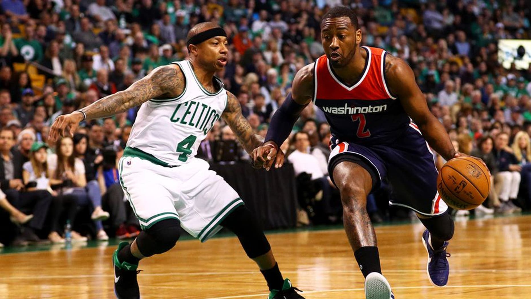 BOSTON, MA - APRIL 30: John Wall #2 of the Washington Wizards drives against Isaiah Thomas #4 of the Boston Celtics during the first quarter of Game One of the Eastern Conference Semifinals at TD Garden on April 30, 2017 in Boston, Massachusetts. NOTE TO USER: User expressly acknowledges and agrees that, by downloading and or using this Photograph, user is consenting to the terms and conditions of the Getty Images License Agreement. (Photo by Maddie Meyer/Getty Images)