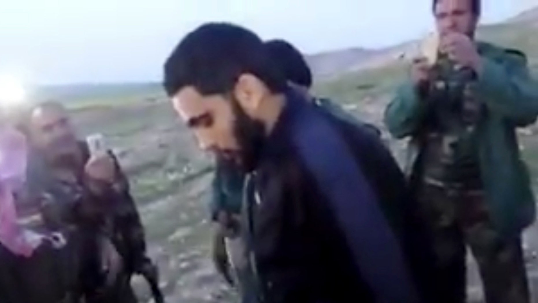 March 14, 2016: This image made from video posted on Twitter by a Kurdish fighter shows a man that the Kurdish military says is an American member of the Islamic State group shortly after he turned himself in to Kurdish fighters in northern Iraq.