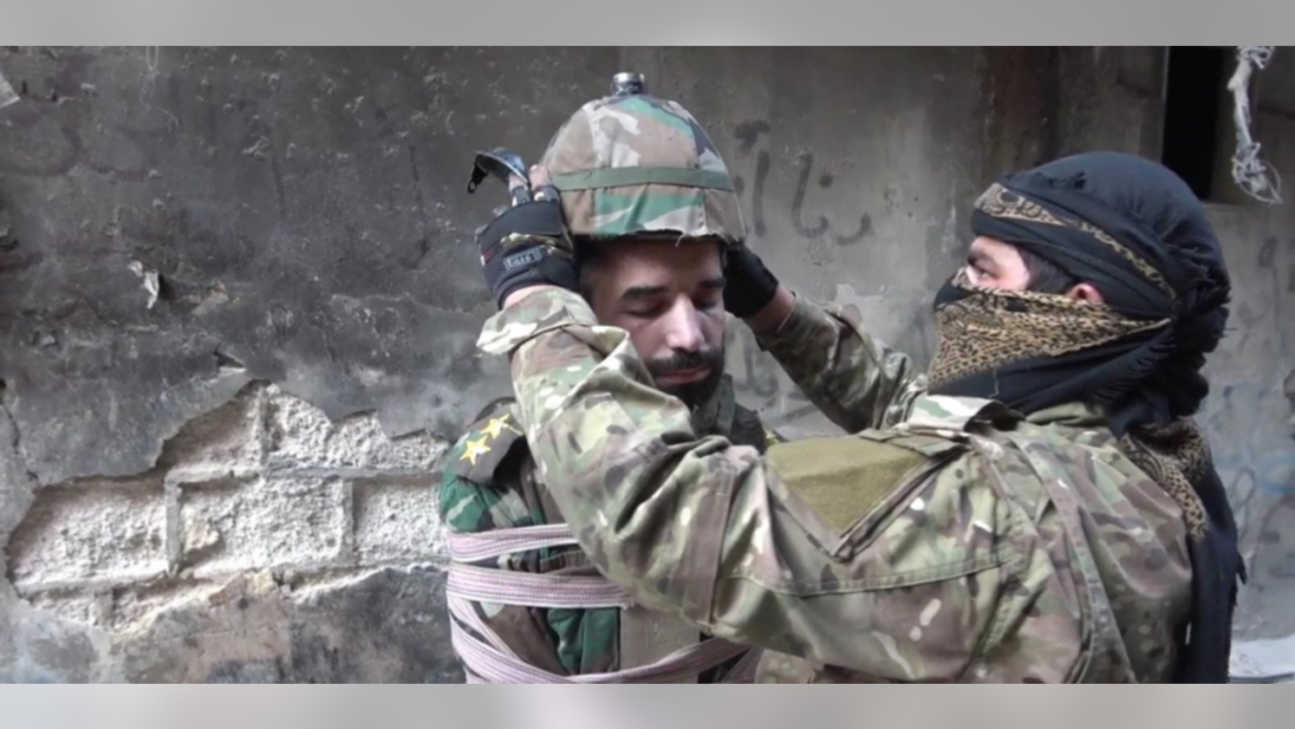 The man was fitted with a helmet filled with explosives before being dropped headfirst from a building.