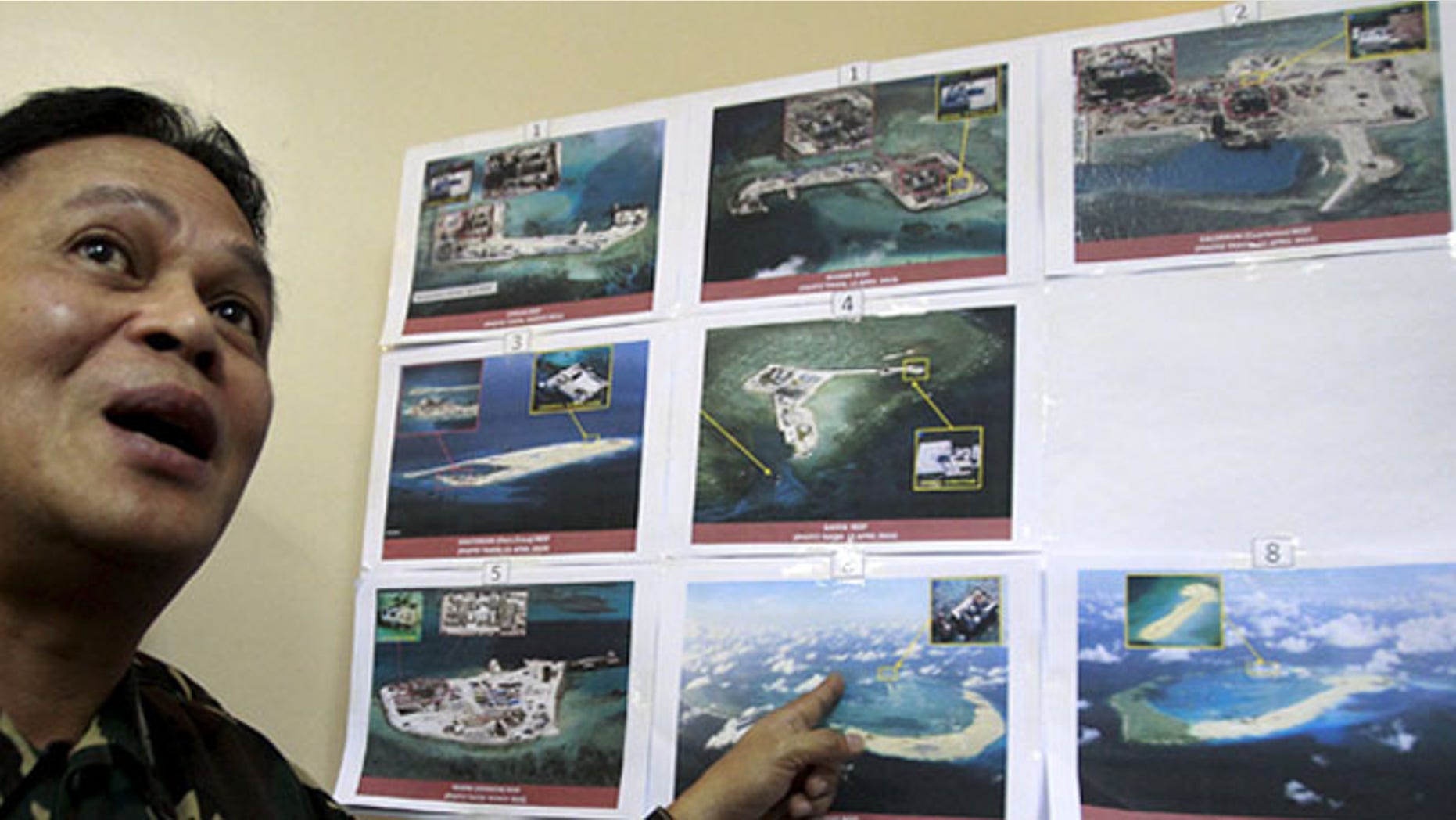 April 20, 2015: A top official with the Armed Forces of the Philippines shows some images of the structures being built by China in the South China Sea.