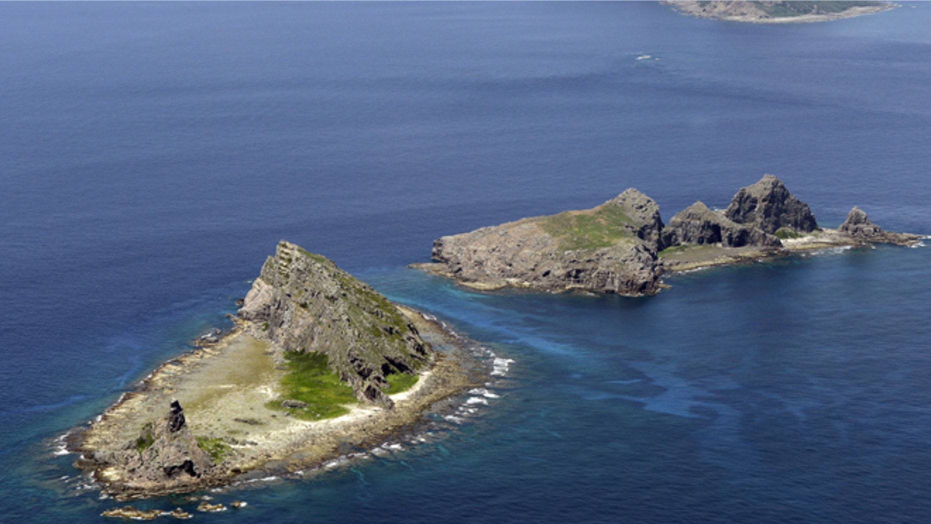 In this Sept. 2012 photo, the tiny islands in the East China Sea, called Senkaku in Japanese and Diaoyu in Chinese are seen.