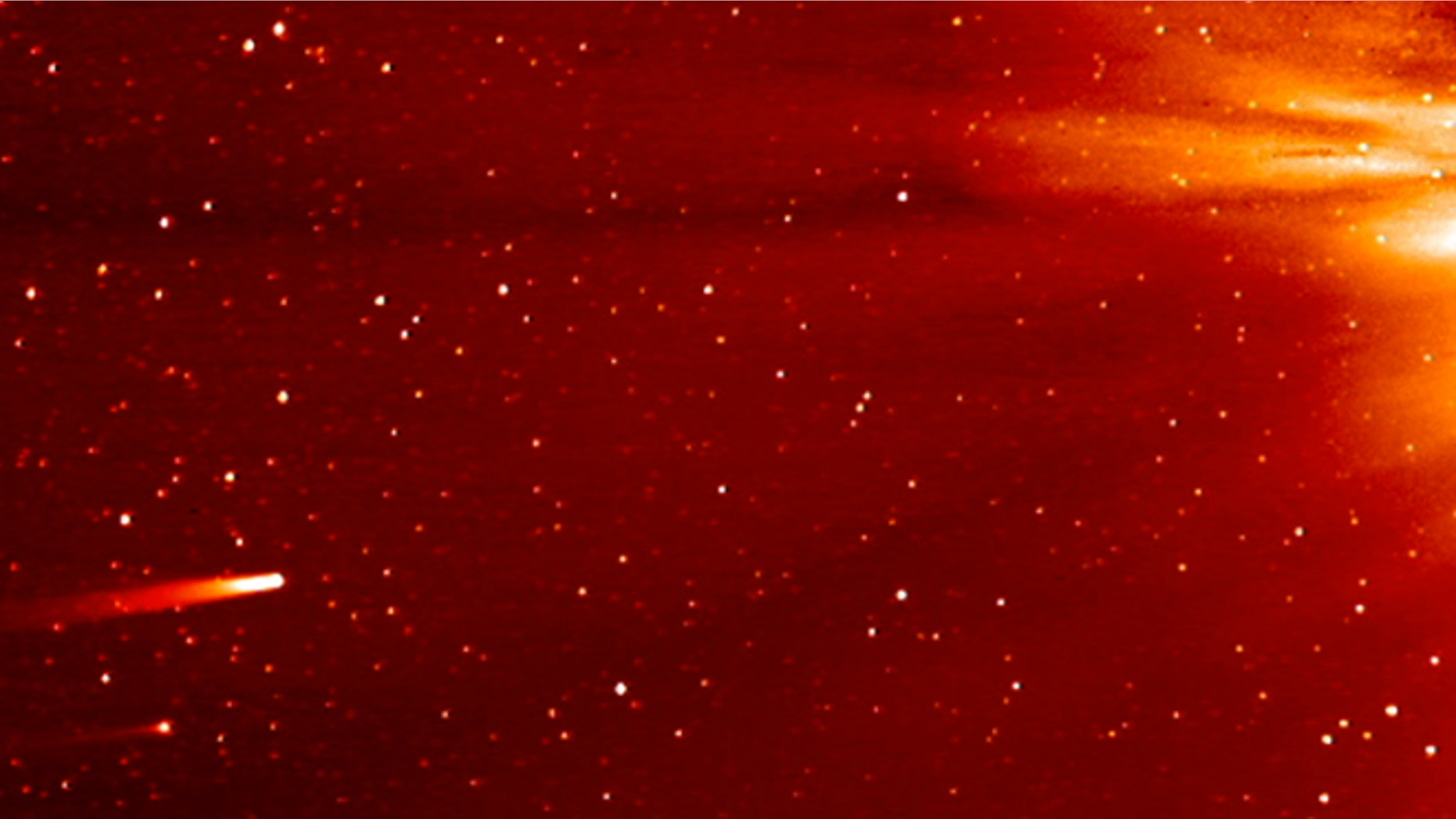 Nov. 25, 2013: In this frame grab taken from enhanced video made by NASA's STEREO-A spacecraft, comet ISON, left, approaches the sun on Nov. 25, 2013.