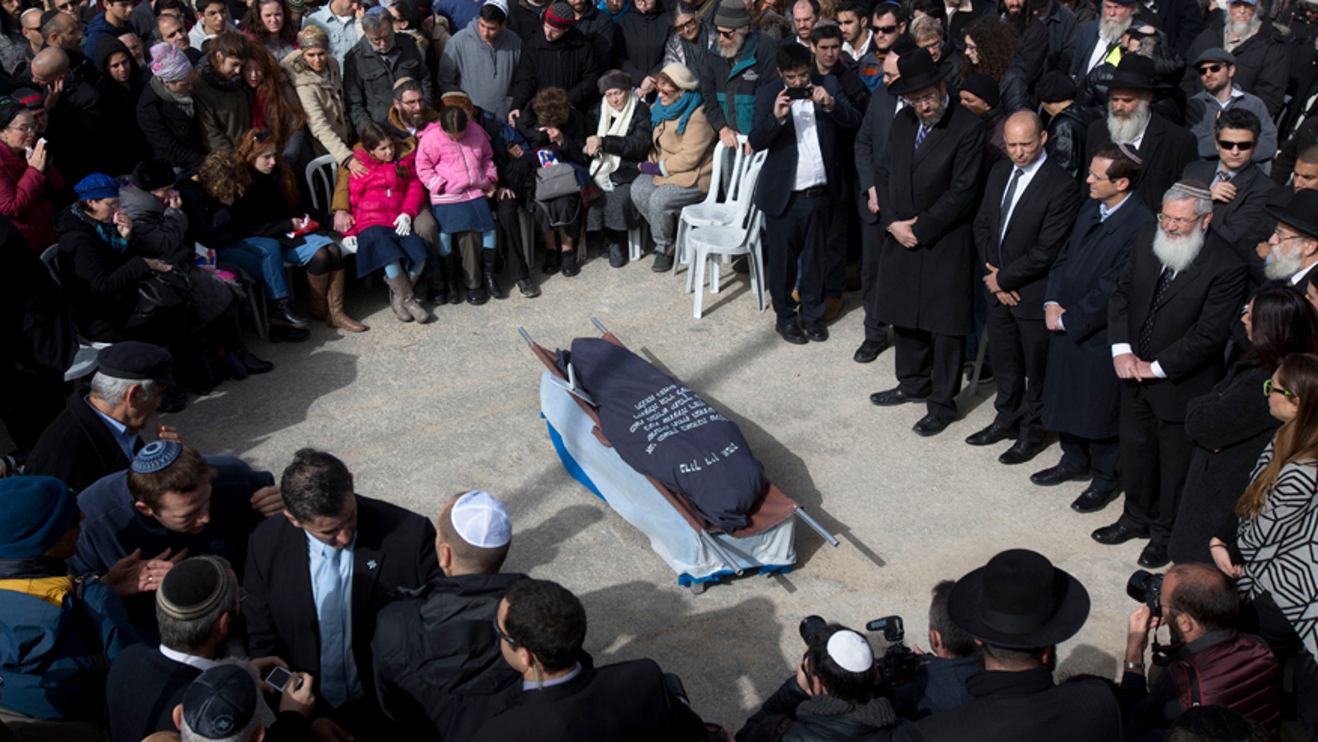 Jan. 18, 2016: Family and friends of Israeli Dafna Meir attend her funeral in a cemetery in Jerusalem.