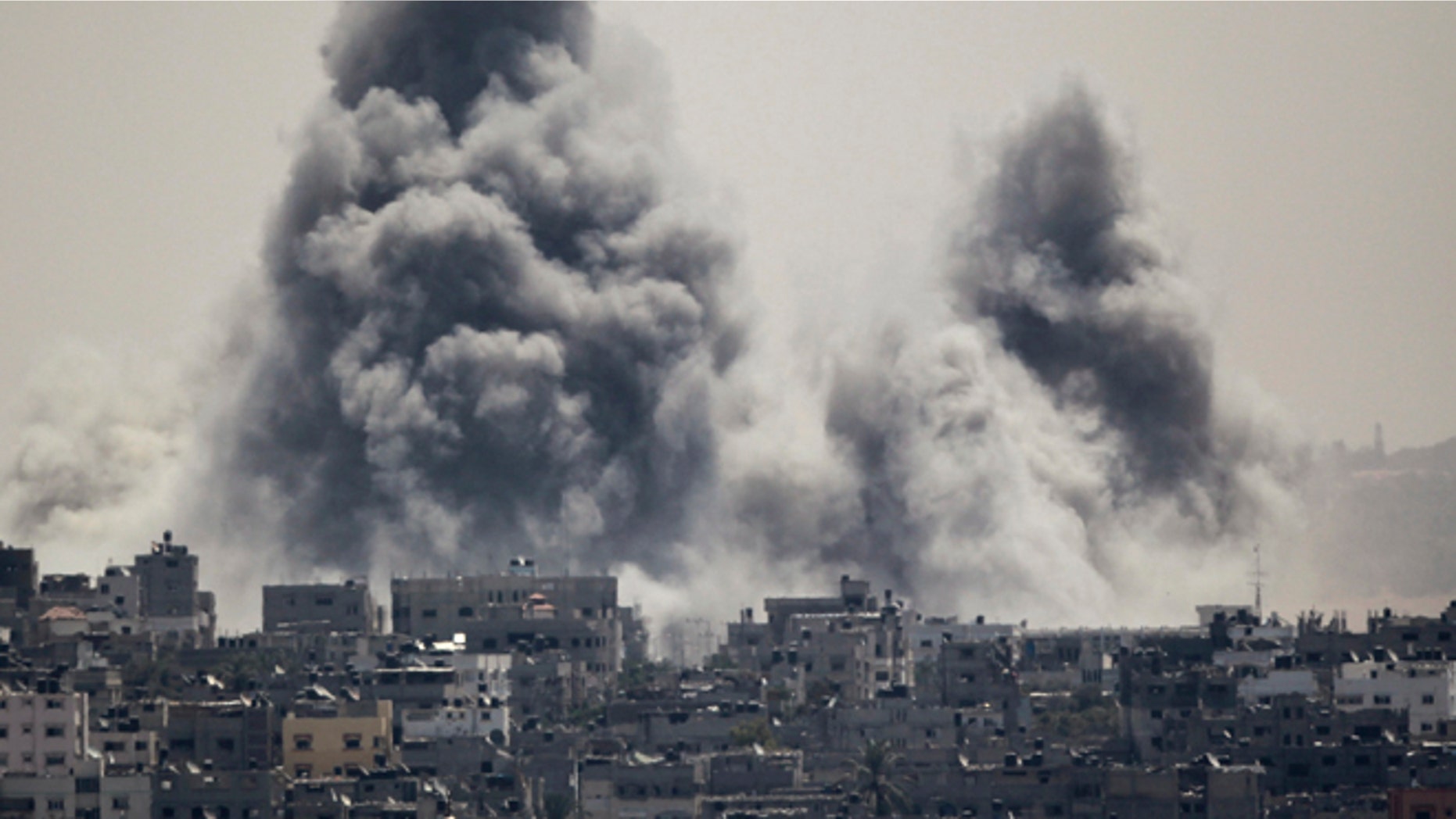 July 27, 2014: Smoke rises during an Israeli offensive in the east of Gaza City, Israel.