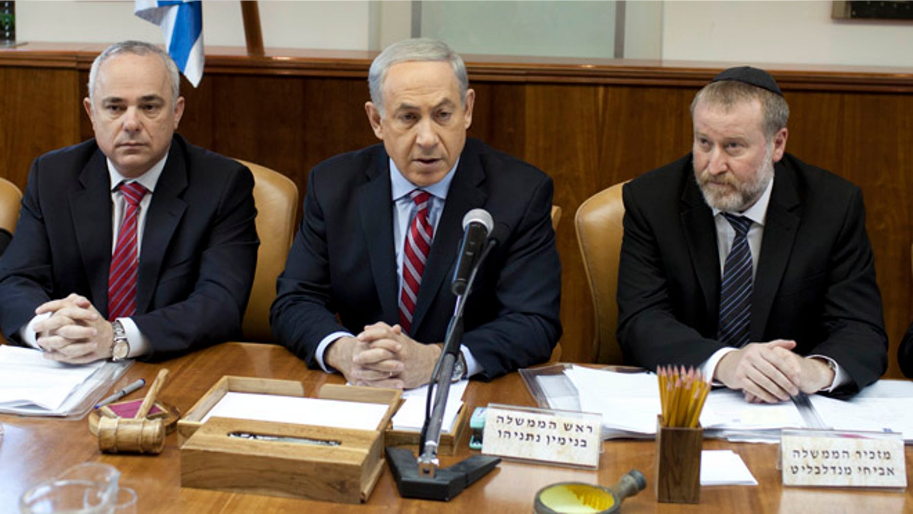 Nov. 24, 2013: Israeli Prime Minister Benjamin Netanyahu, center, attends the weekly cabinet meeting at his office in Jerusalem, Israel.