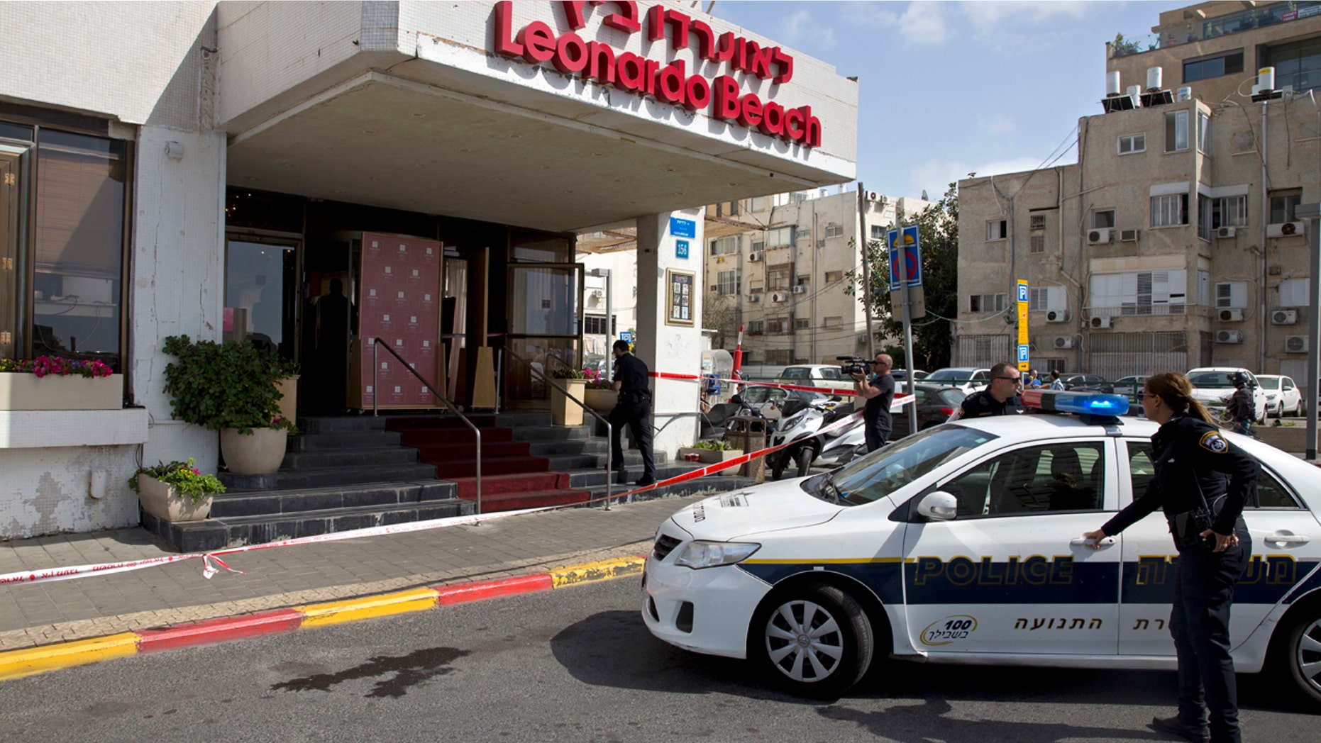 Israeli police officers stand guard at the scene of a stabbing attack in Tel Aviv, Israel. Sunday, April 23, 2017.