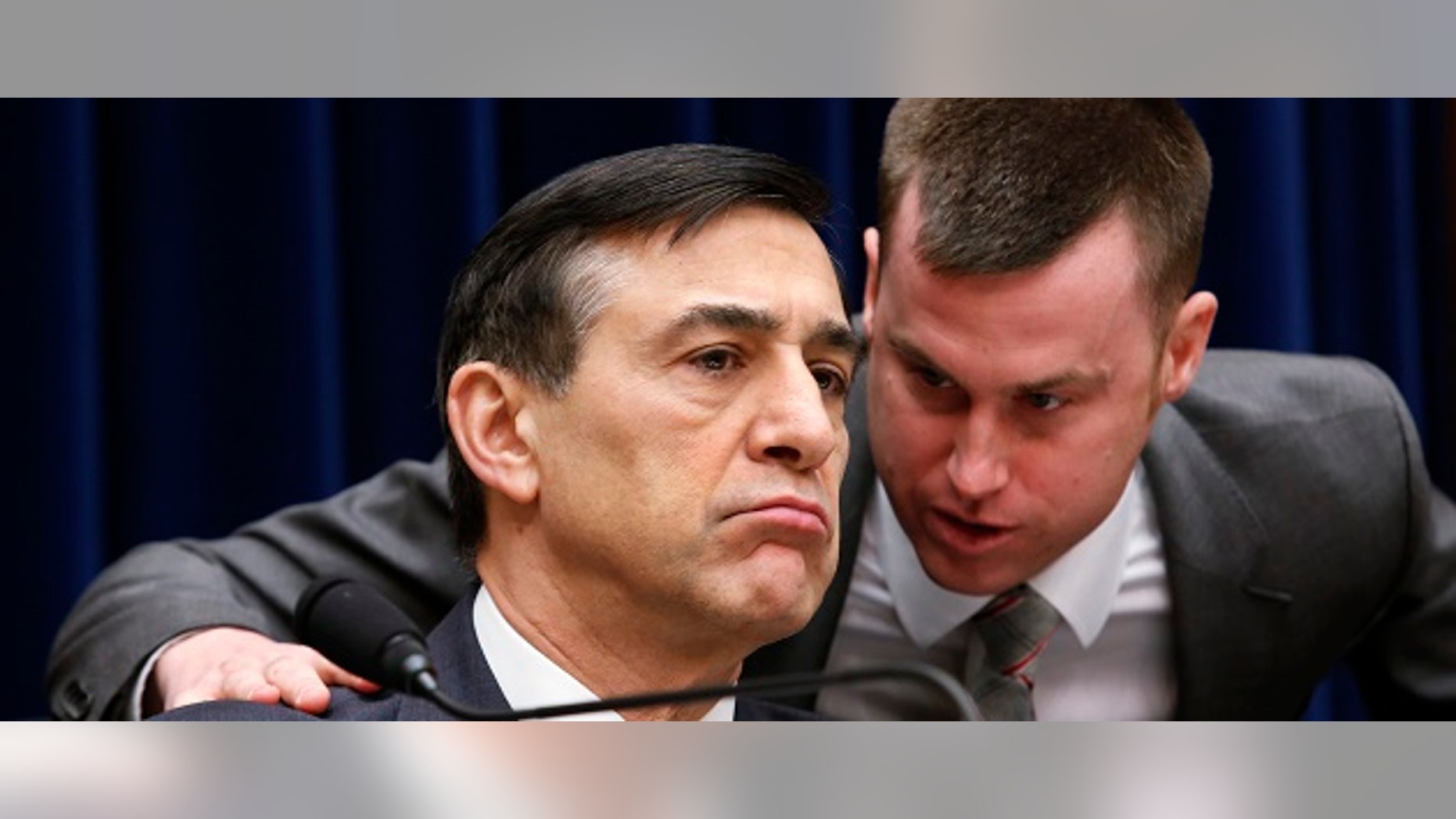 FILE: Chairman of the House Oversight and Government Reform Committee Rep. Darrell Issa listens to his staff member during the Committee hearing.