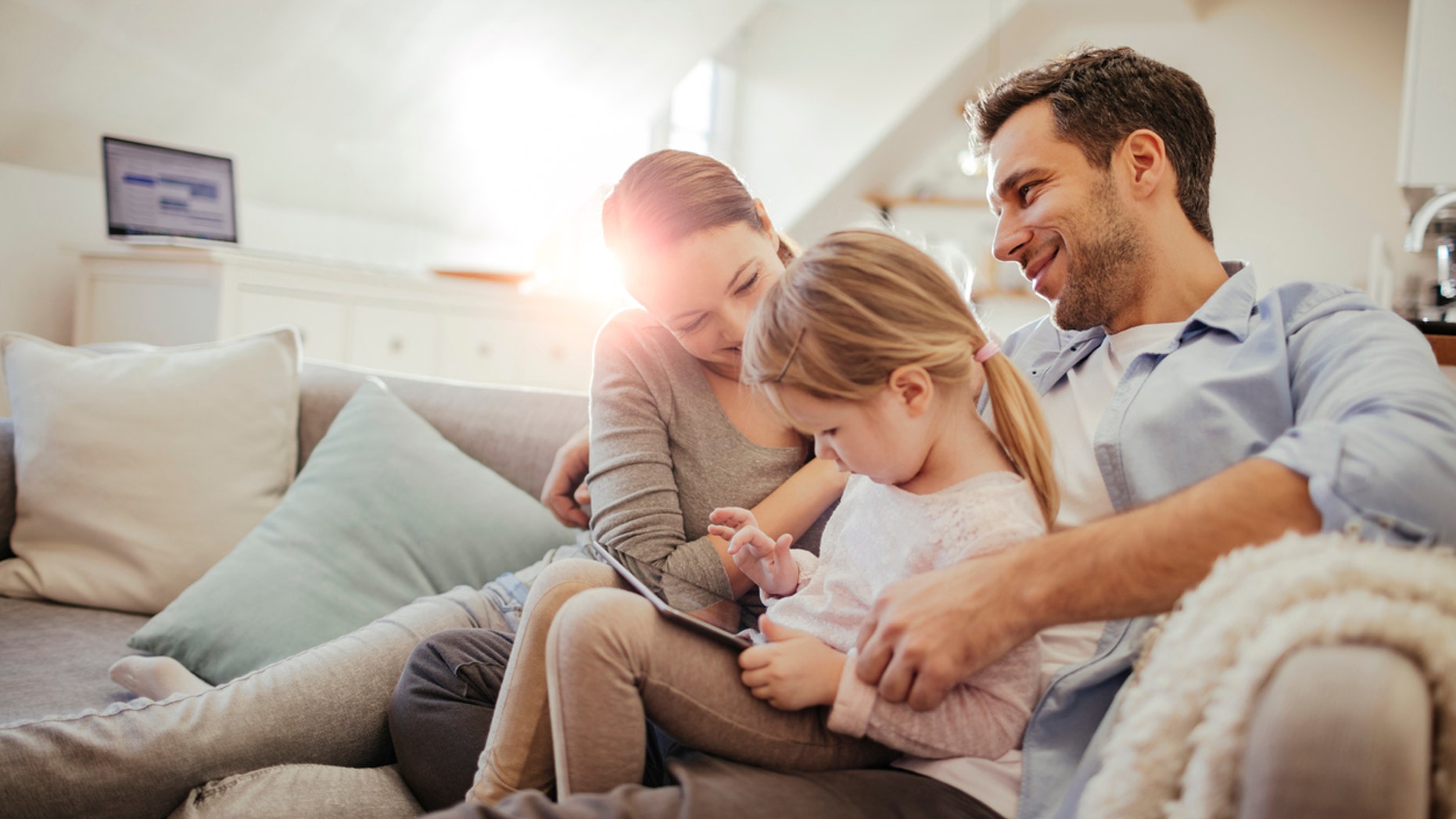 Close up of a happy young family playing at home