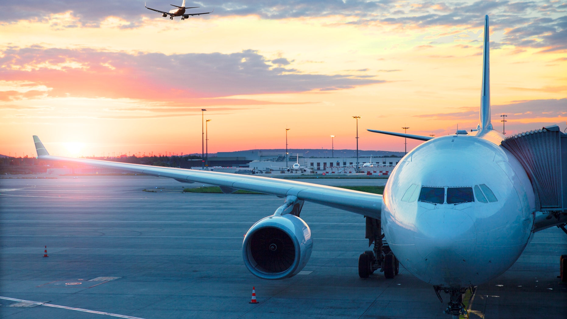 Charles De Gaulle , International airport in Paris - Airplane at sunrise.