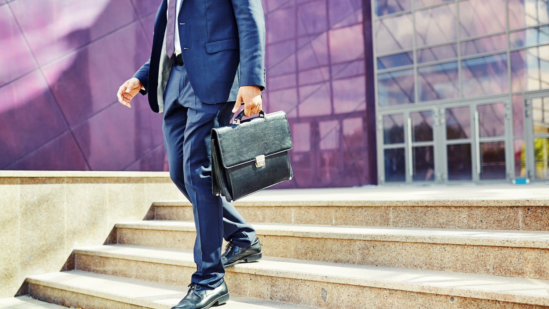 Image of businessman leaving office building