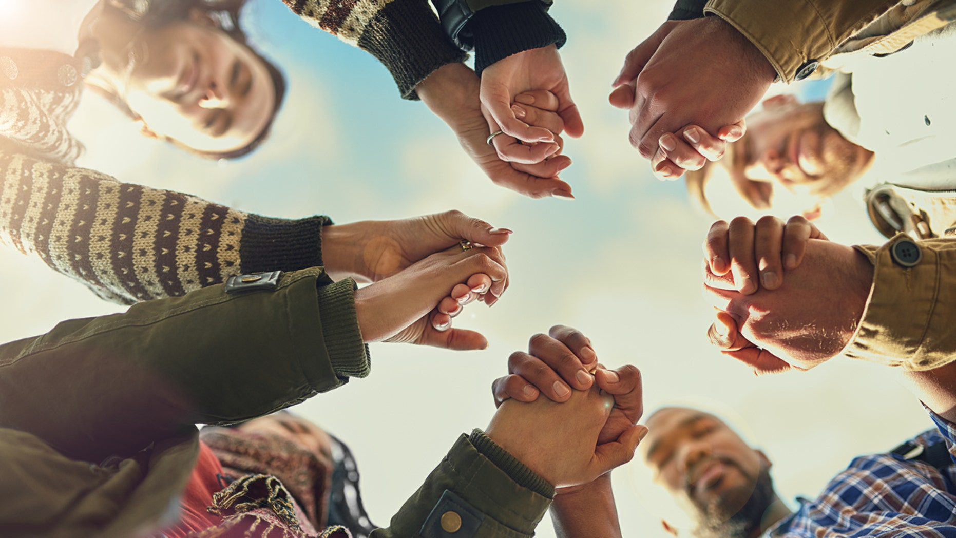 atheist joining hands to say prayers at dinner time