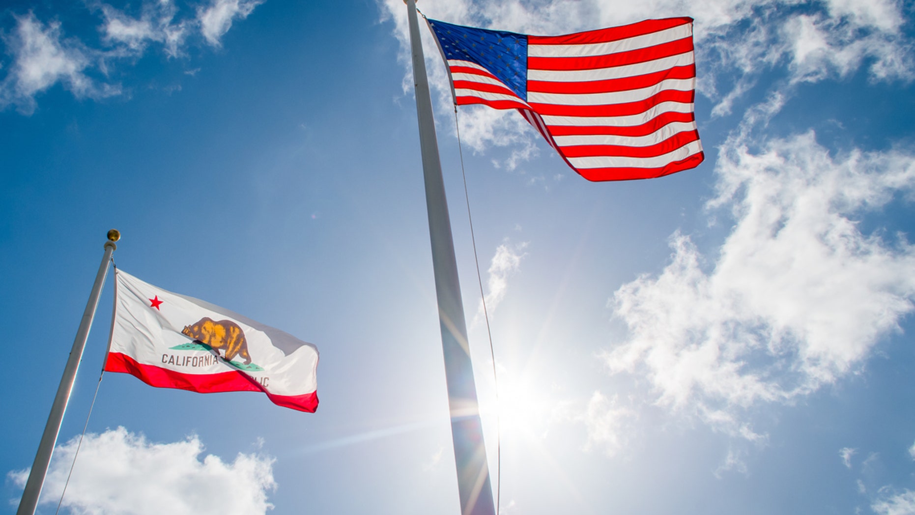 American and California State flags.