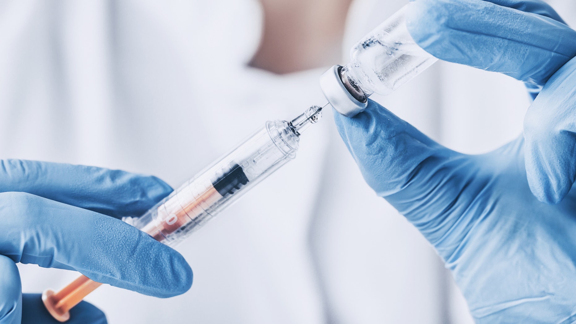 When it came time for the vaccinations, Antwon Lee held his son in his arms and told the little boy to "stay strong," while Shamekia Harris, Lee’s girlfriend, recorded the visit on her phone.
