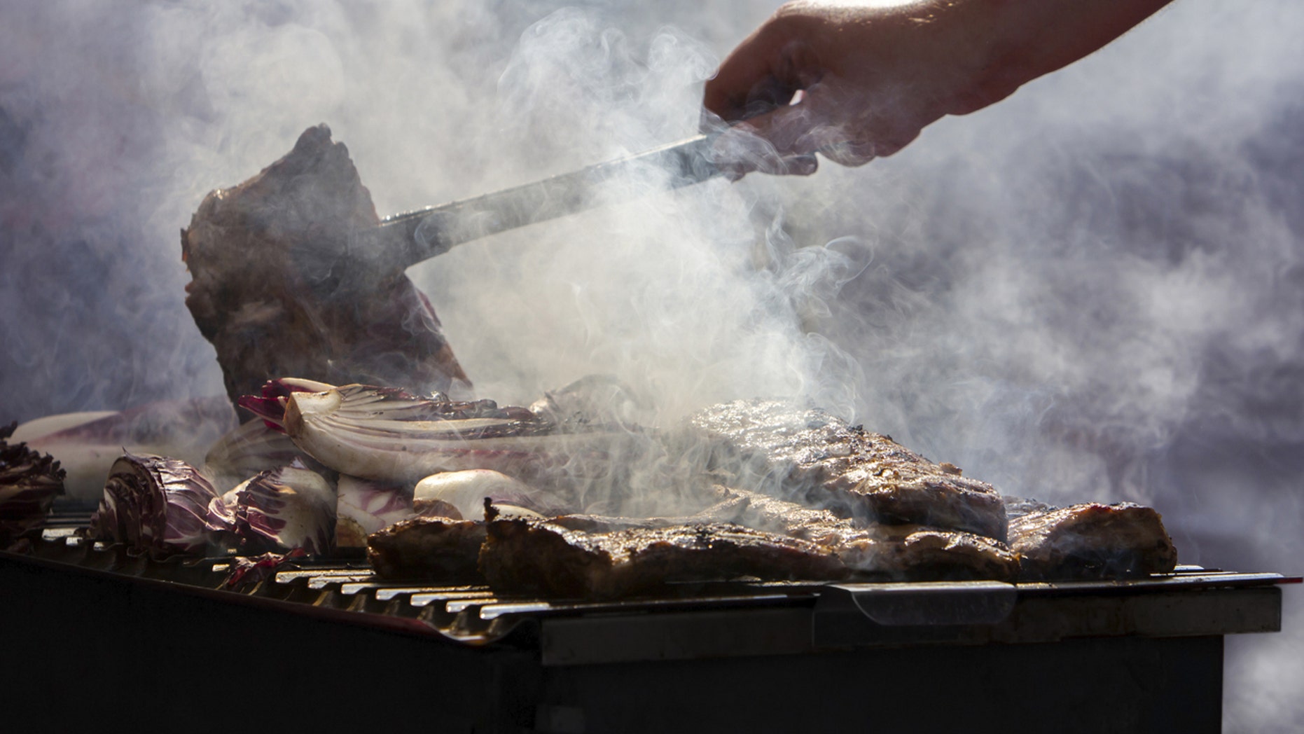 Here’s a step-by-step guide on how to turn your backyard grill into a smoker this summer.