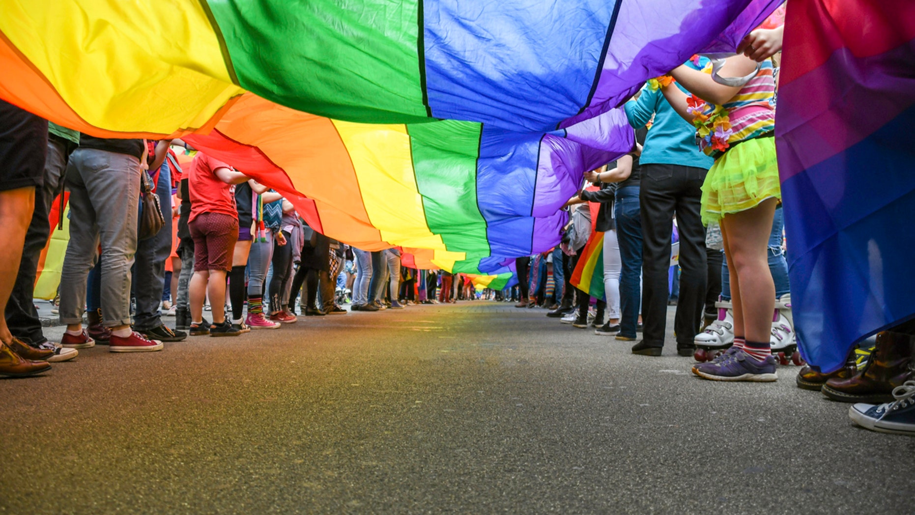 Under a LGBT Pride Flag, taken at Exeter Pride Parade, public event.