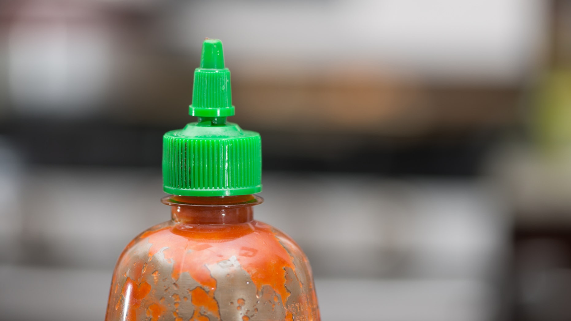 A lack of Sriracha sauce led to one man's arrest and a seriously irritated woman.