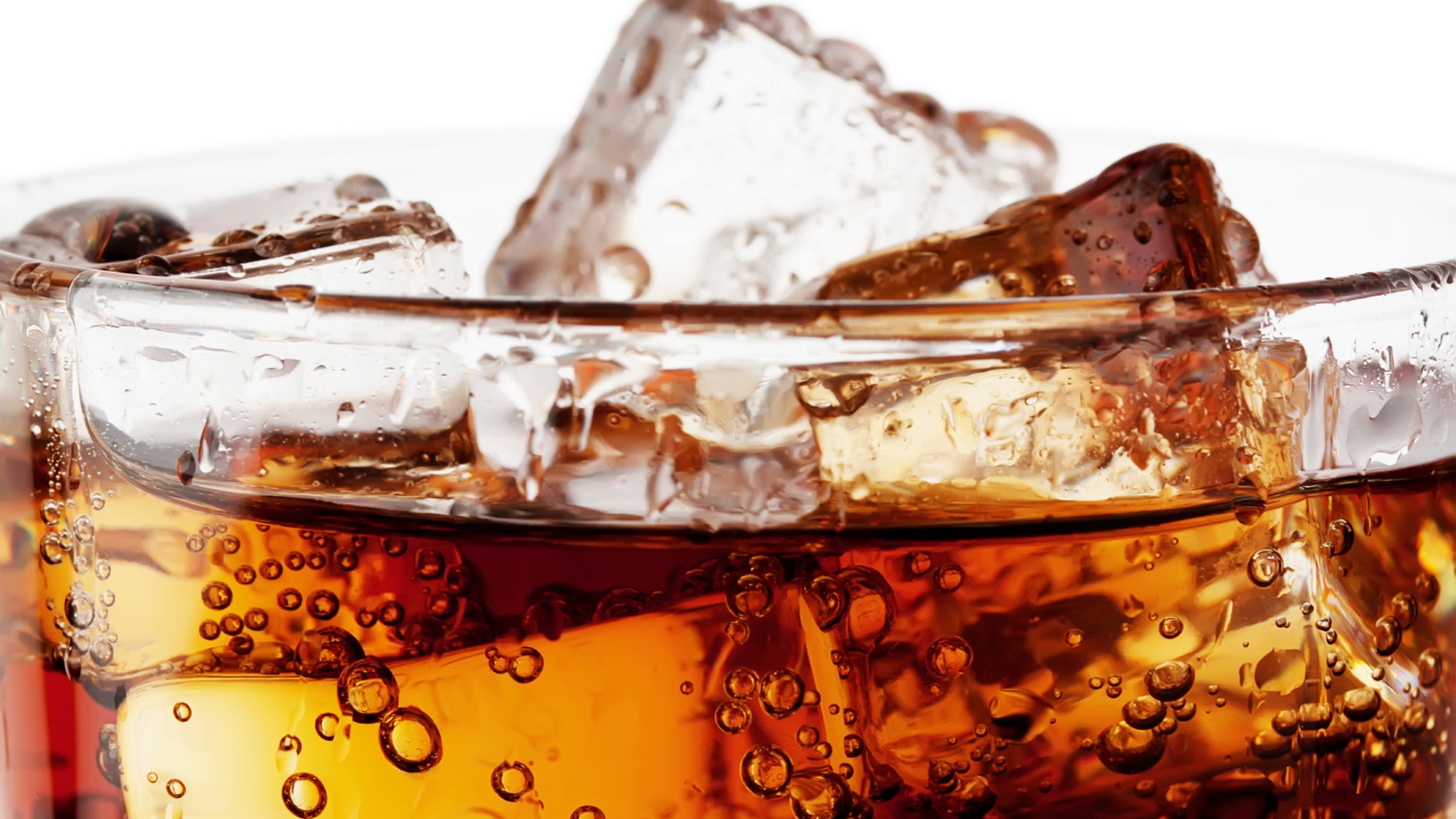 Fragment of glass cola with ice isolated on white background