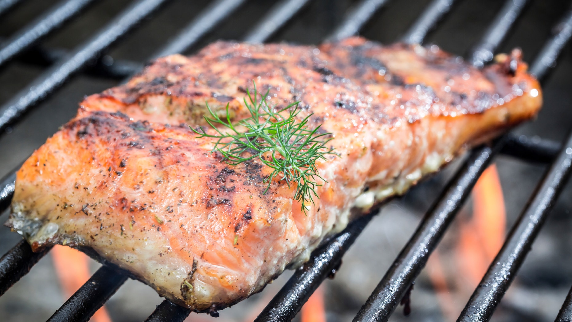 Baked salmon on the grill with fire