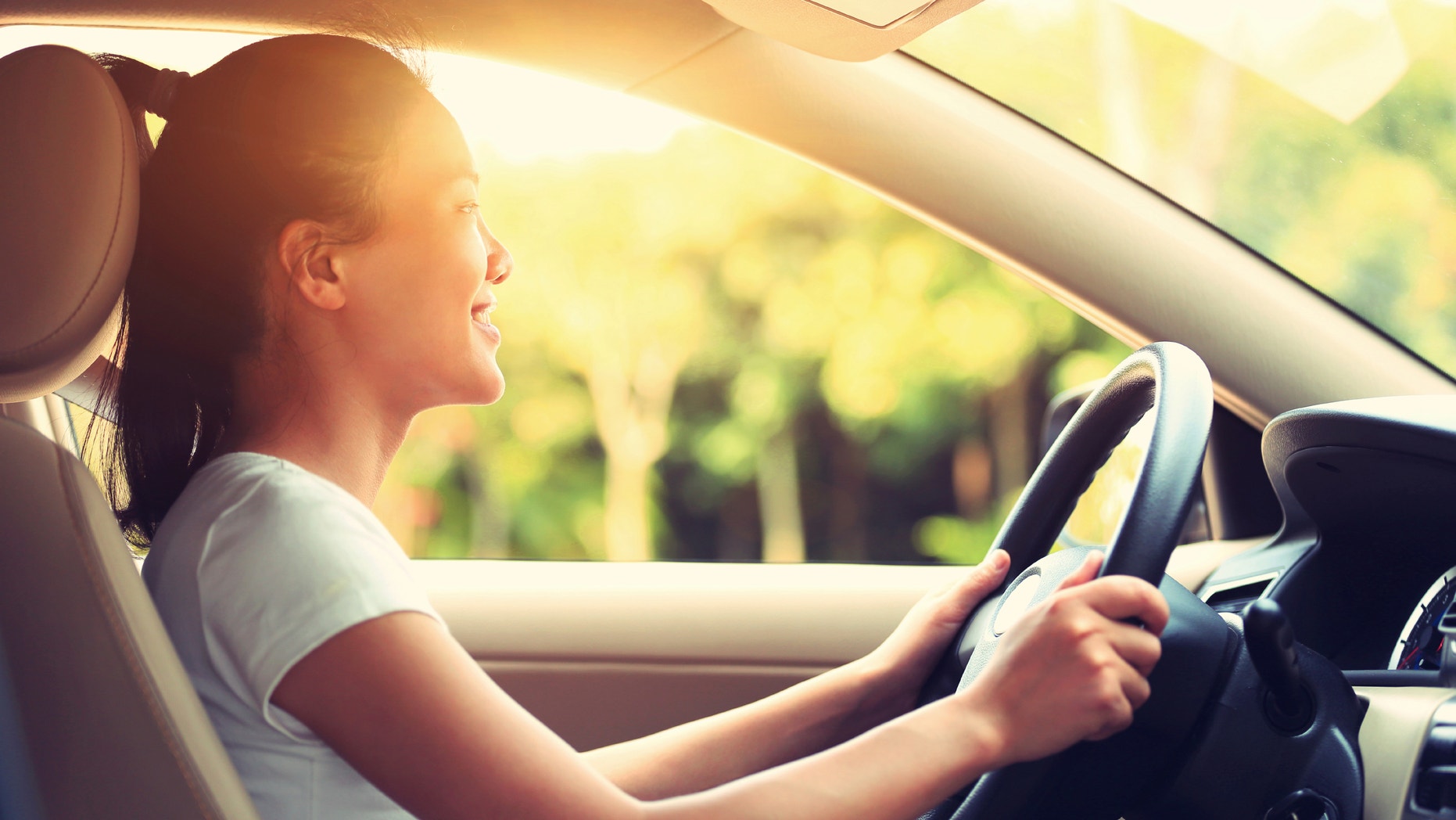 young asian woman driver driving a car,vintage effect
