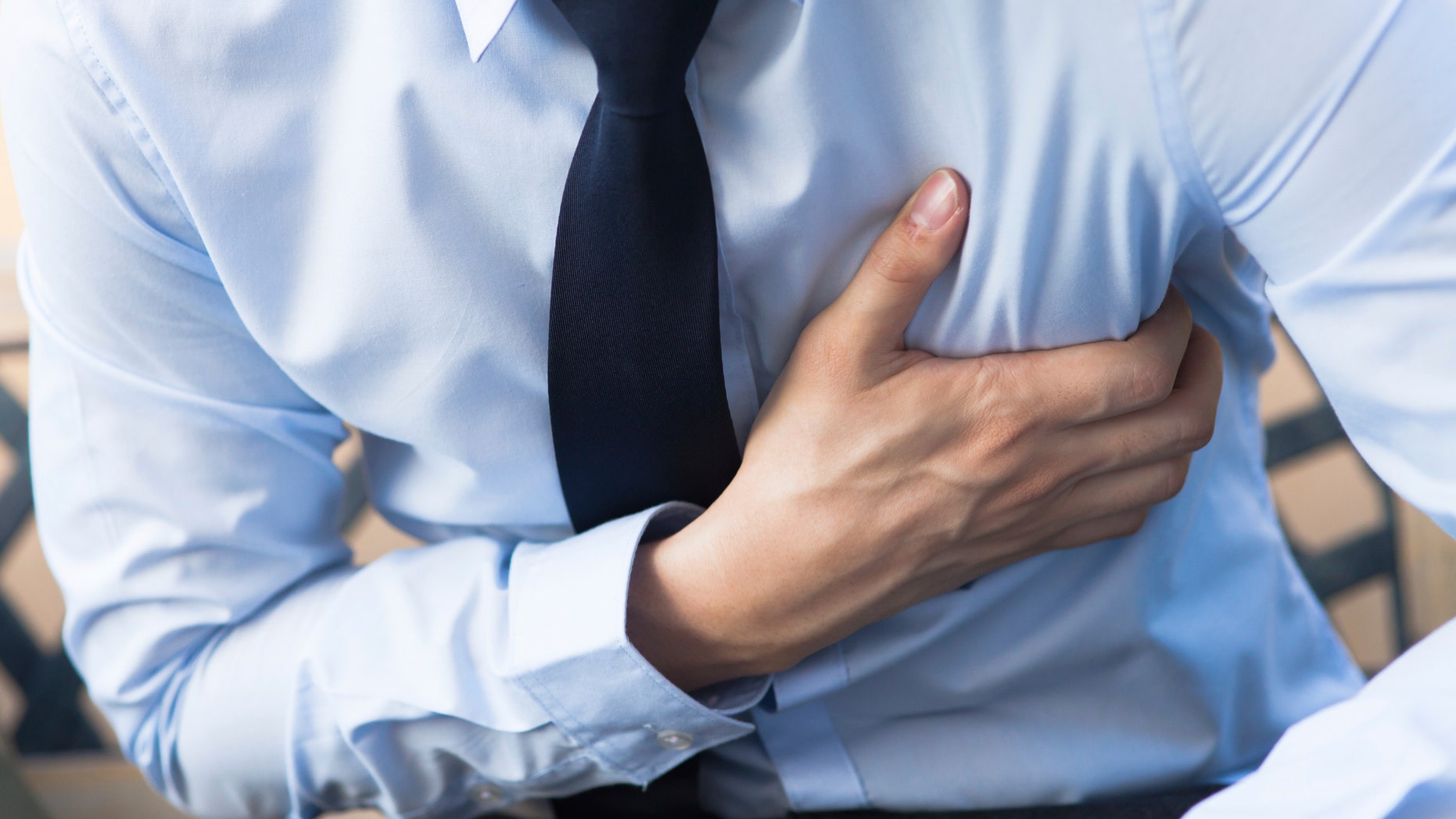 Man in office uniform having heart attack / heart burn